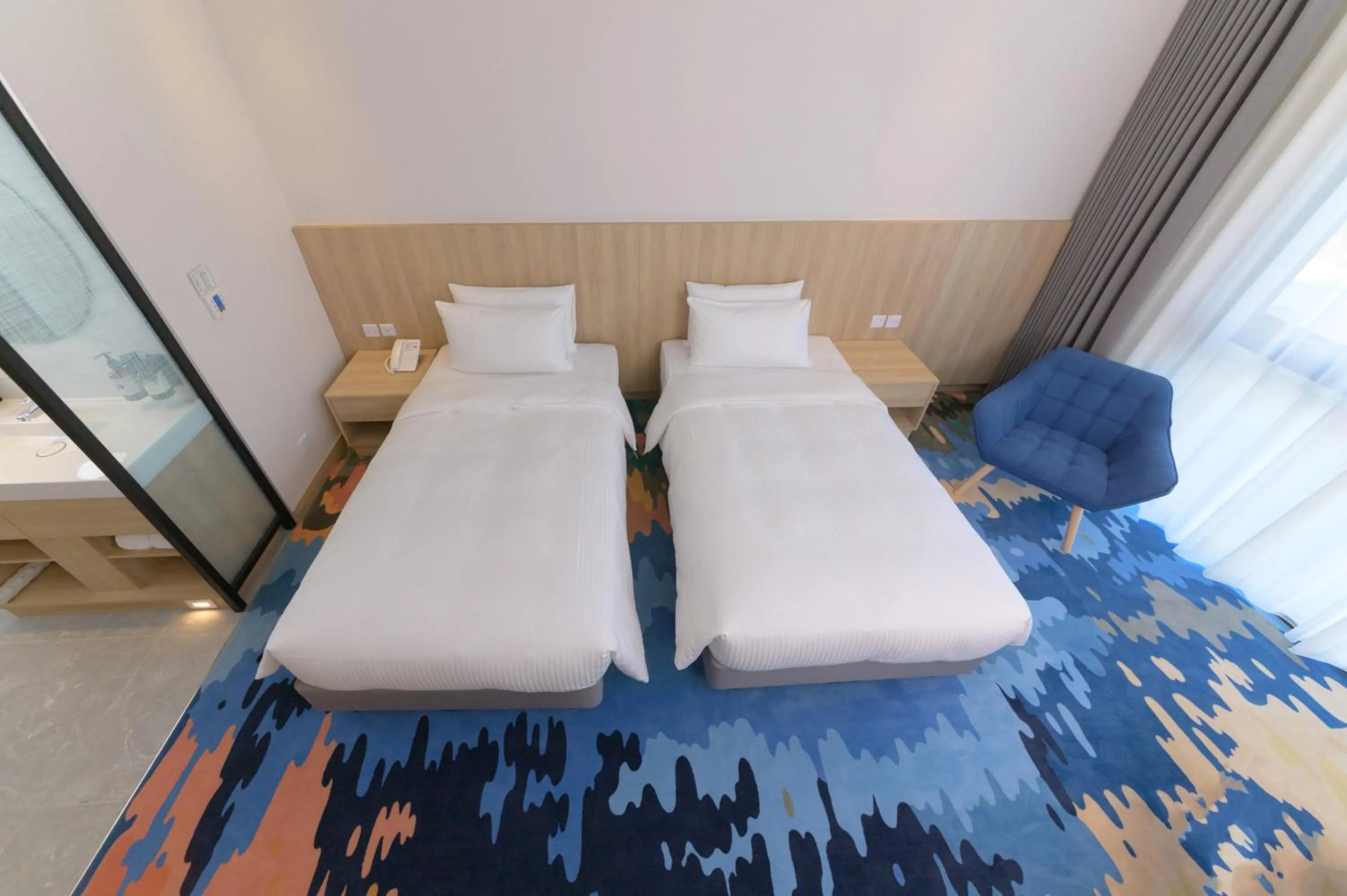 Bed in JANDA Golden Tulip Hotel