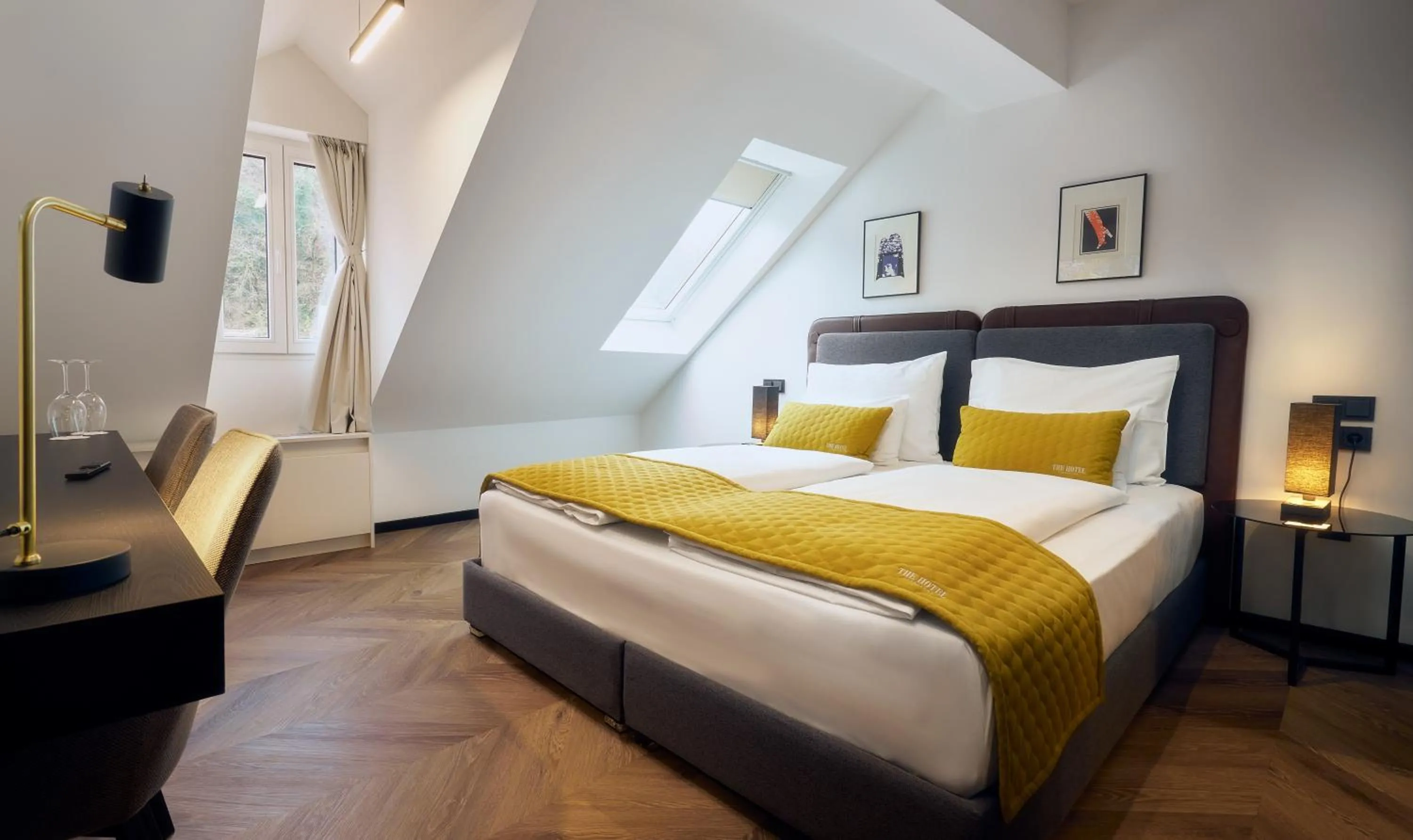 Bed in The Hotel Ljubljana