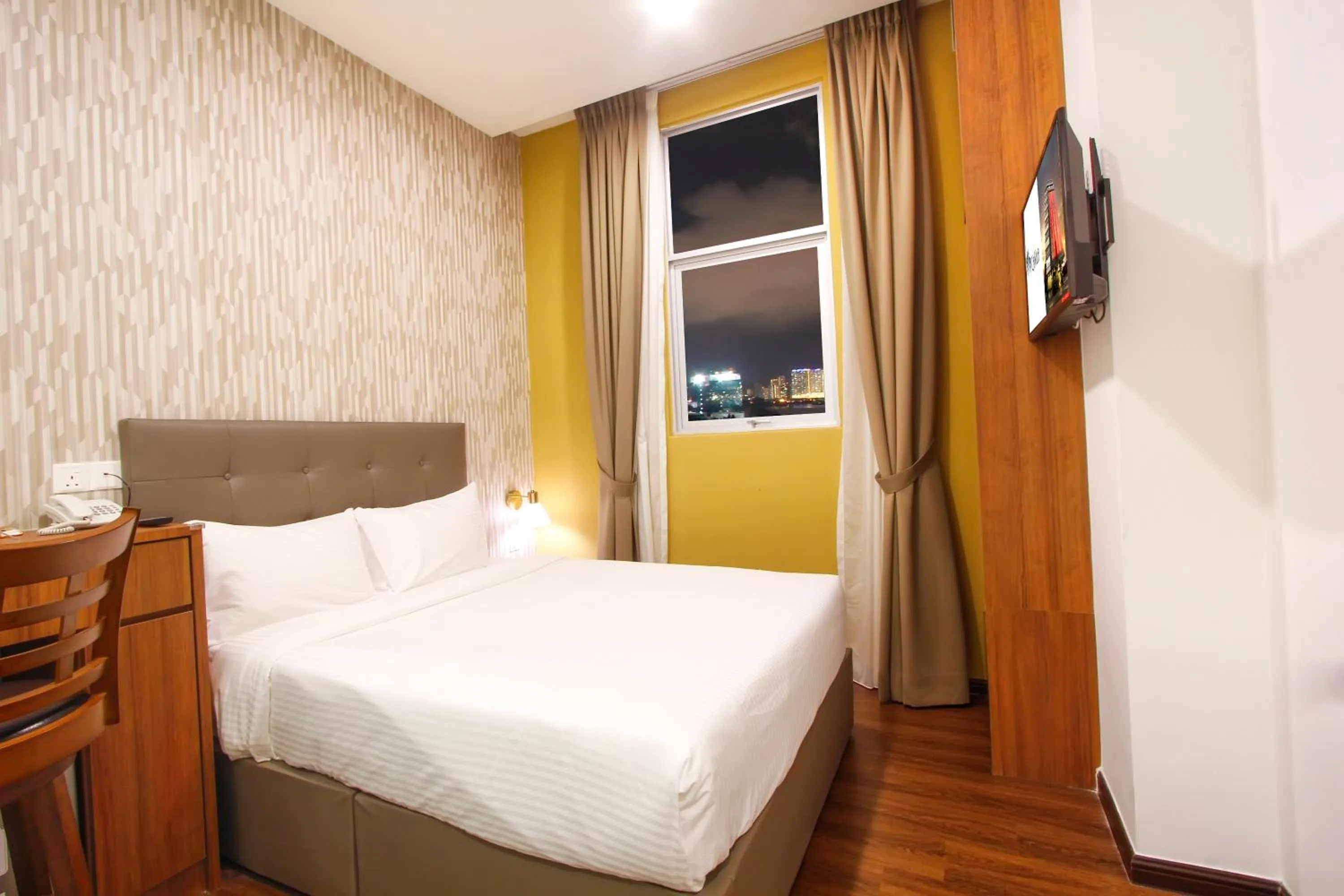 Bed in CitiVilla Hotel Penang