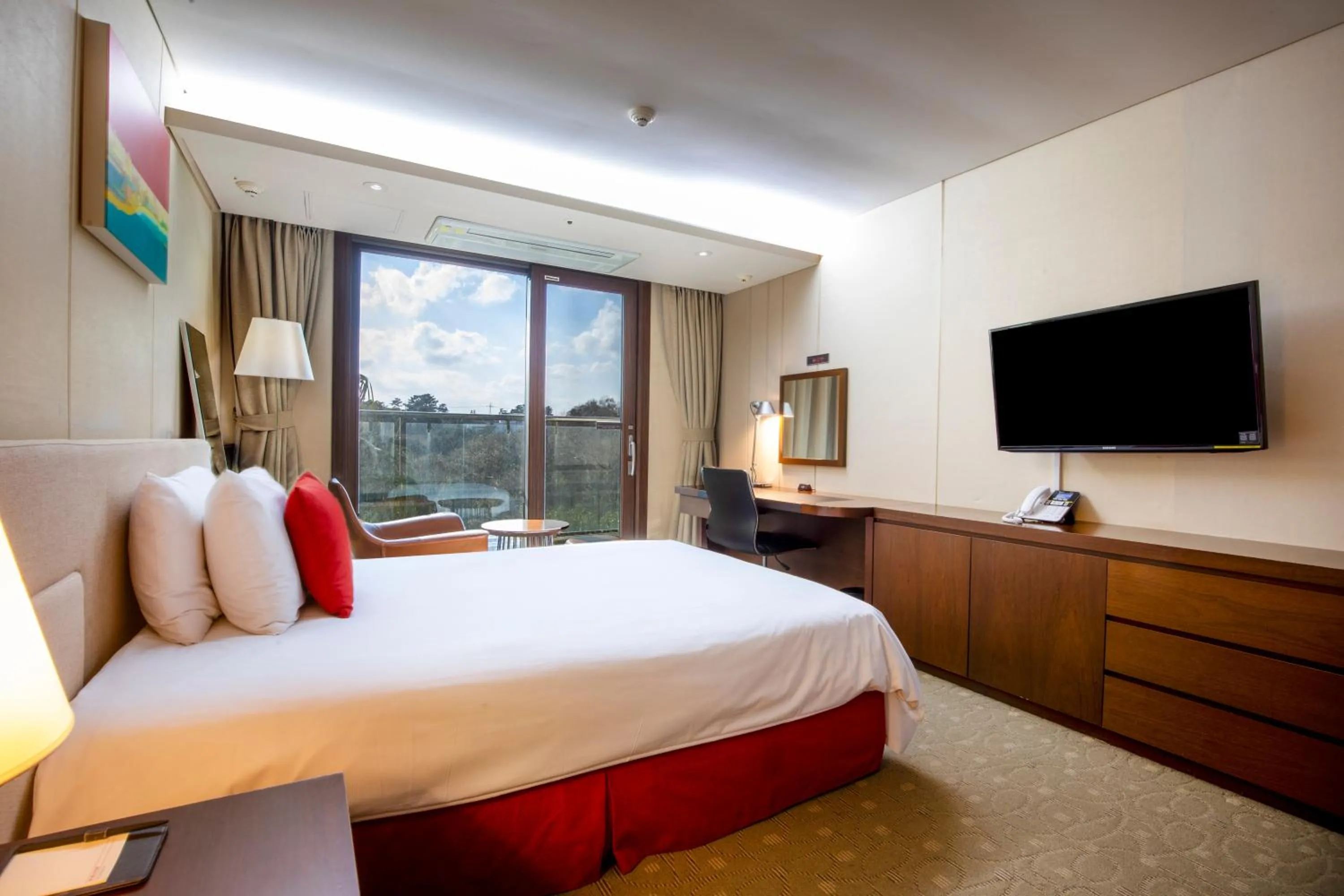 Bed in Ramada by Wyndham Jeju Hamdeok