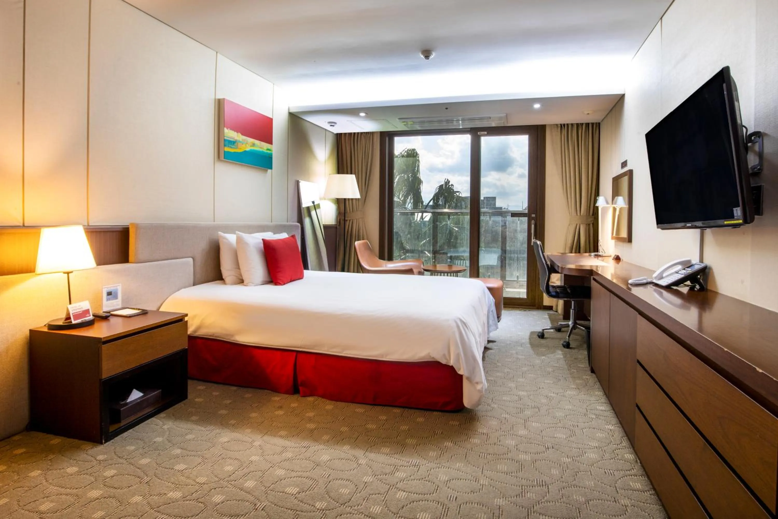 Bed in Ramada by Wyndham Jeju Hamdeok