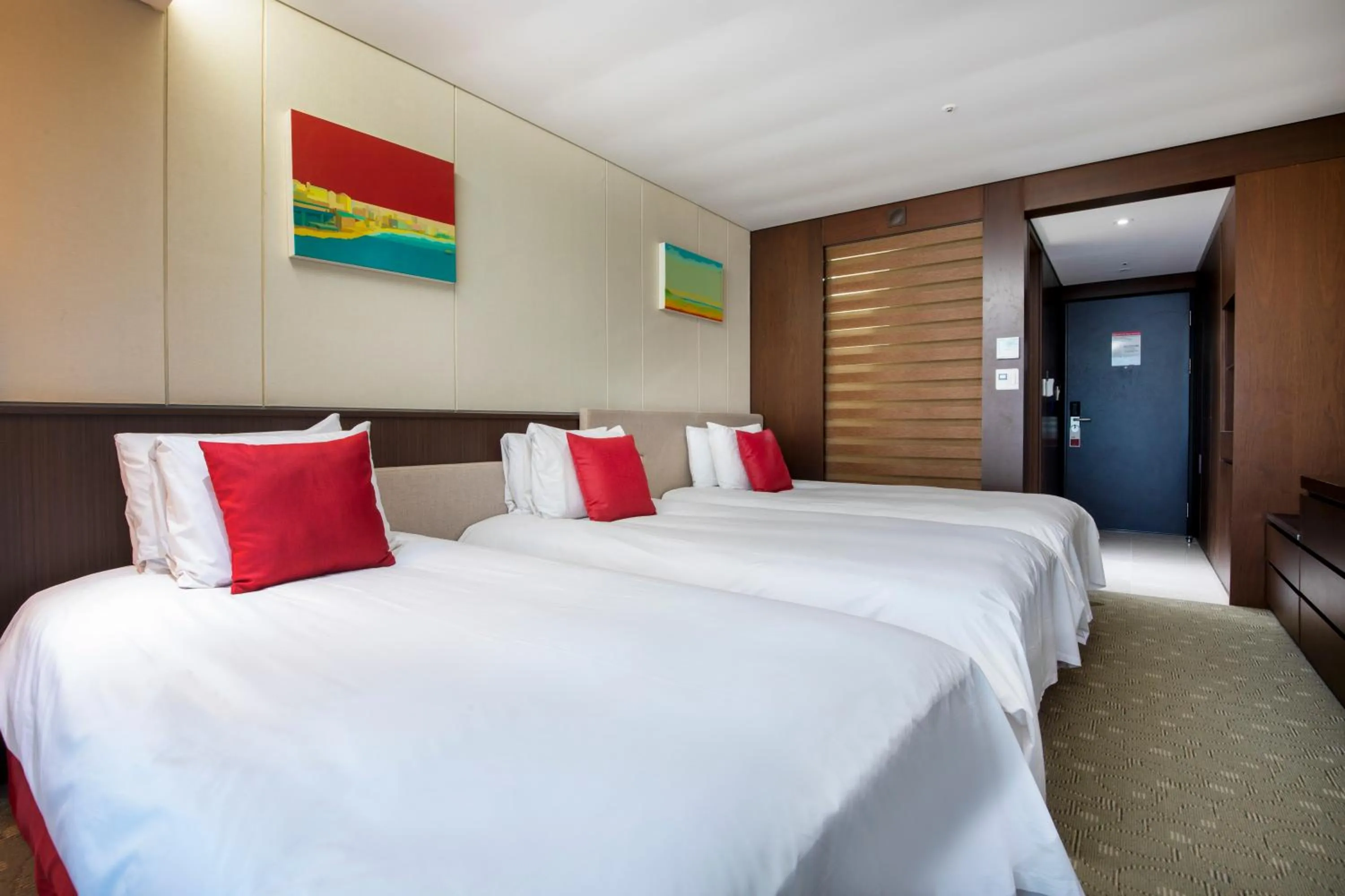 Bed in Ramada by Wyndham Jeju Hamdeok