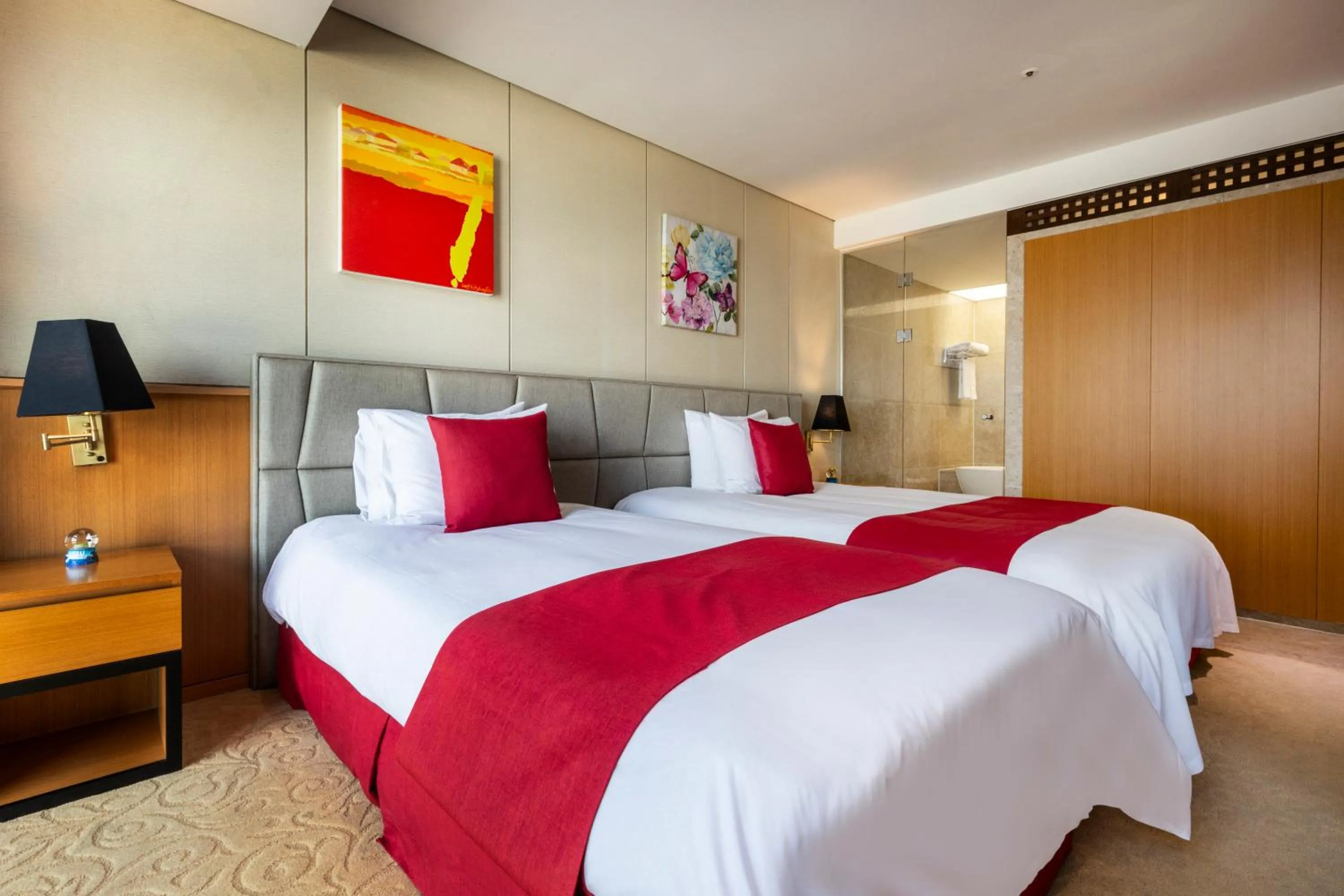 Bed in Ramada by Wyndham Jeju Hamdeok