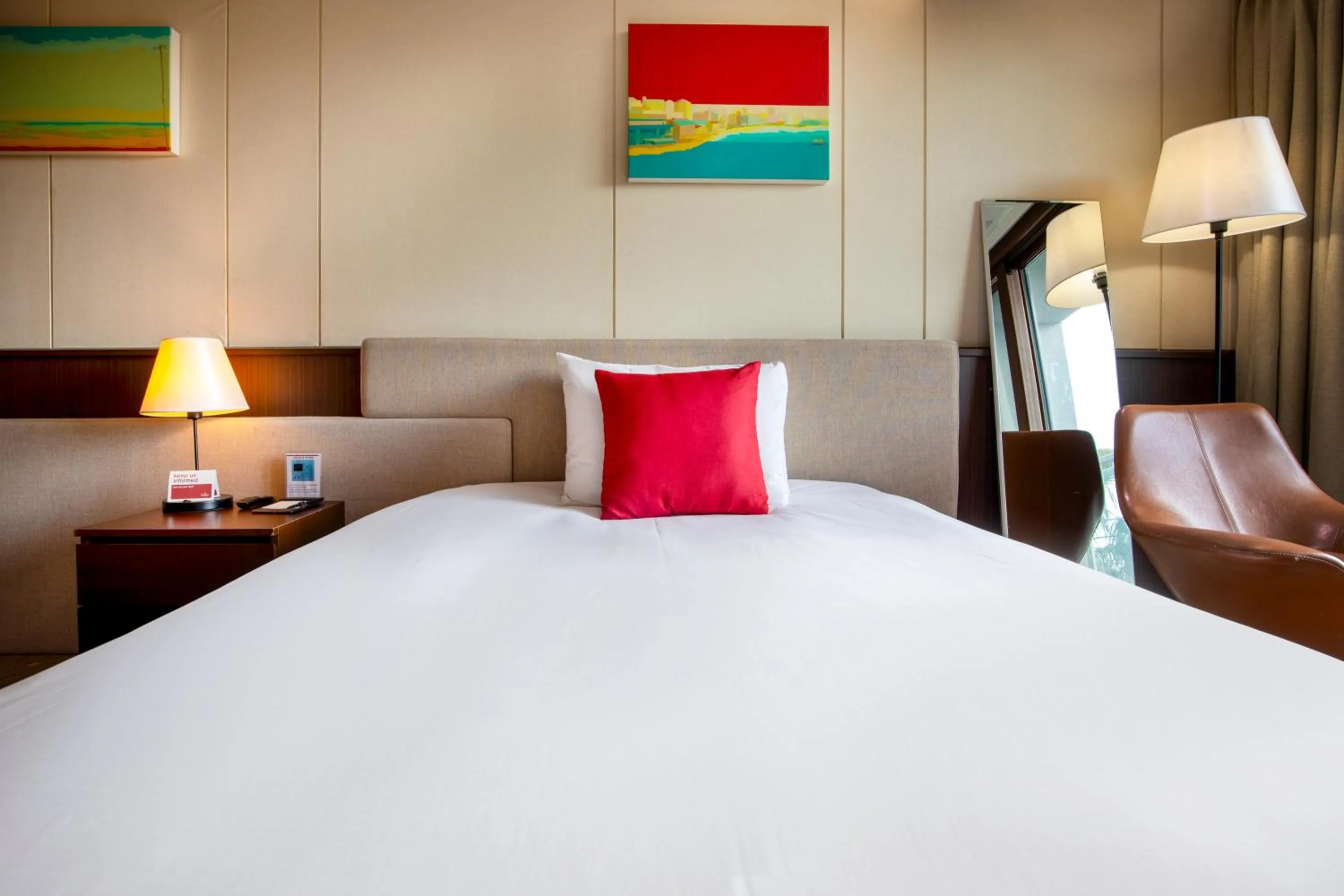 Bed in Ramada by Wyndham Jeju Hamdeok