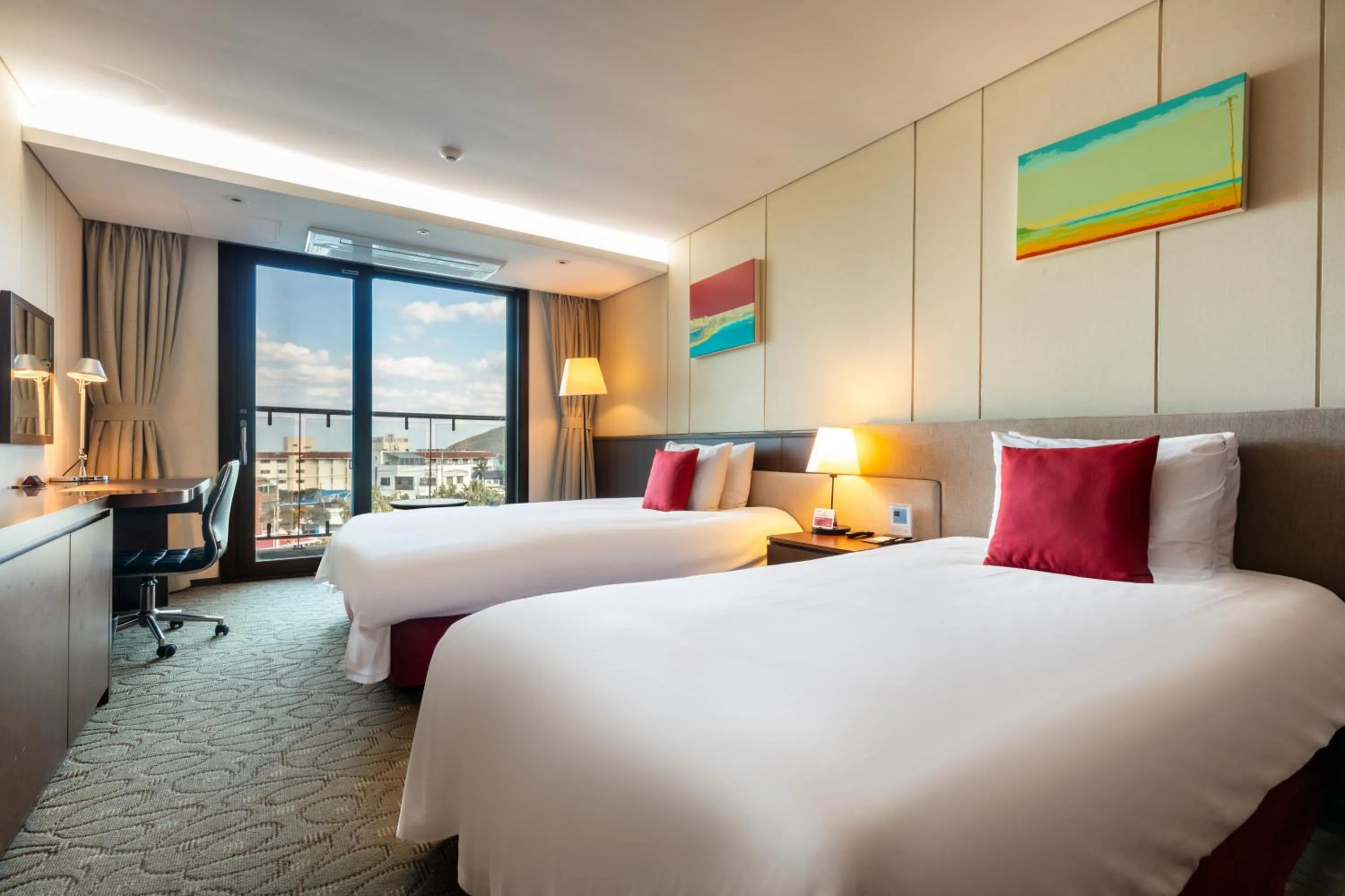 Bed in Ramada by Wyndham Jeju Hamdeok