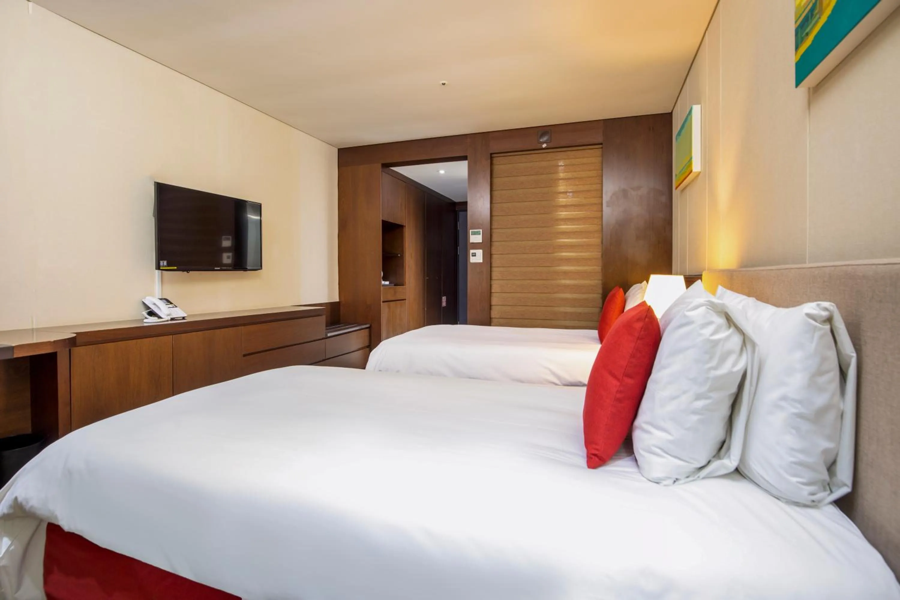 Bed in Ramada by Wyndham Jeju Hamdeok