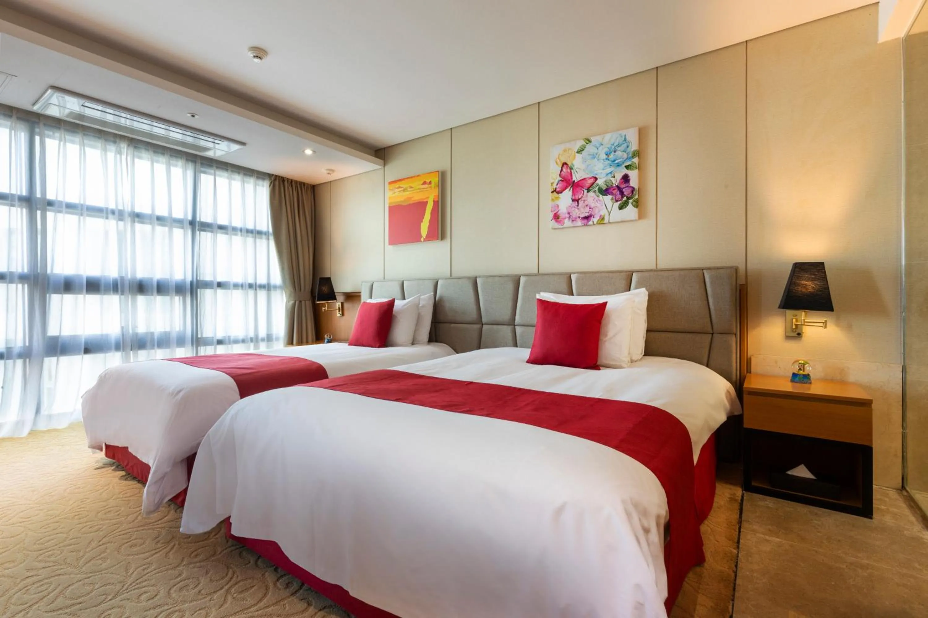 Bed in Ramada by Wyndham Jeju Hamdeok