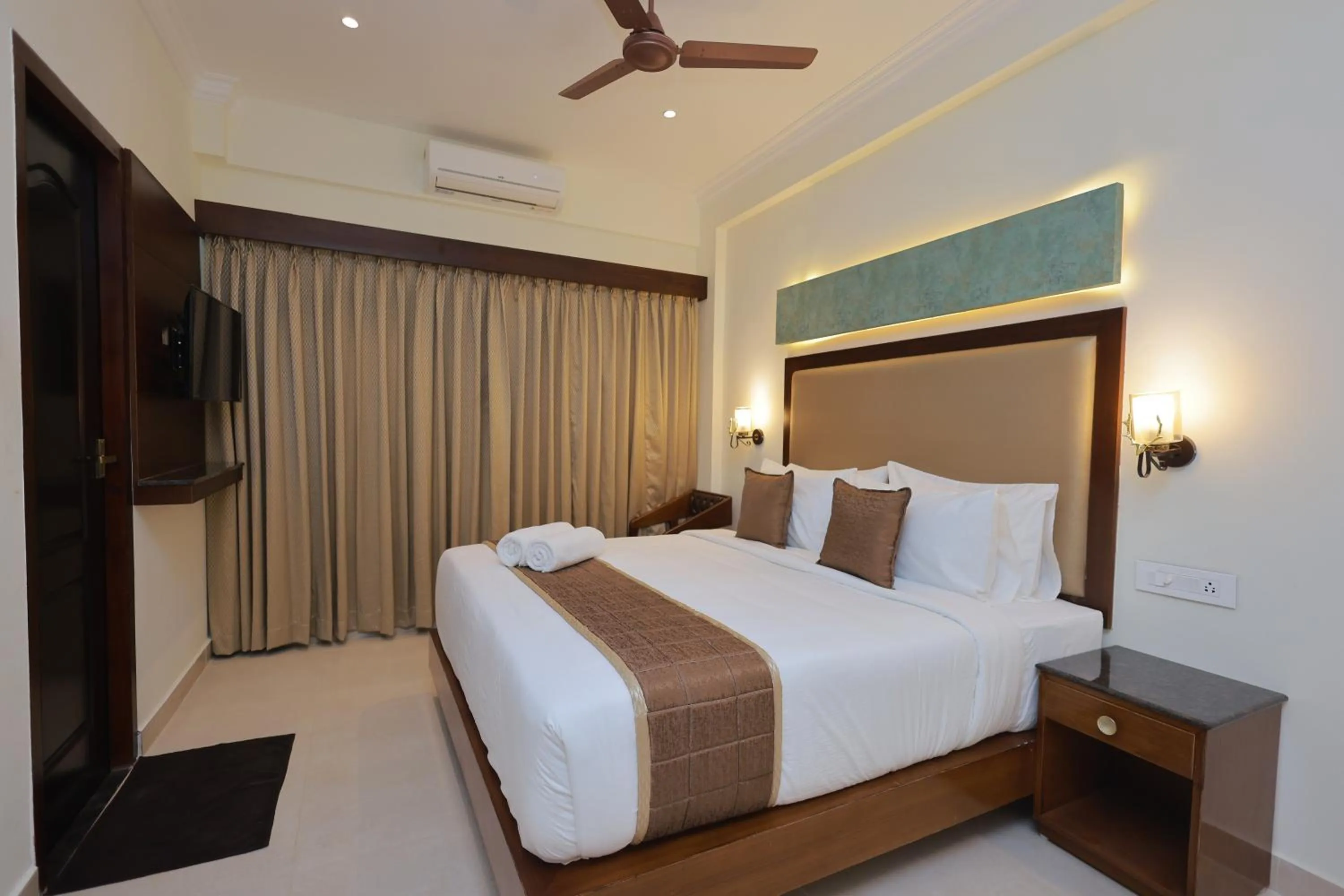 Bed in Hotel Comorin Grand