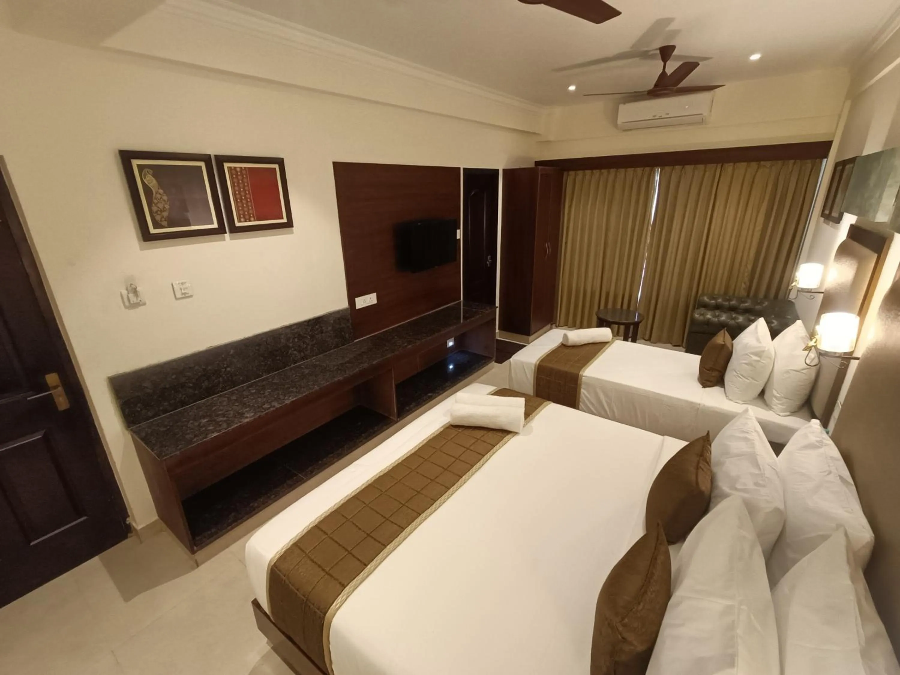 Bed in Hotel Comorin Grand