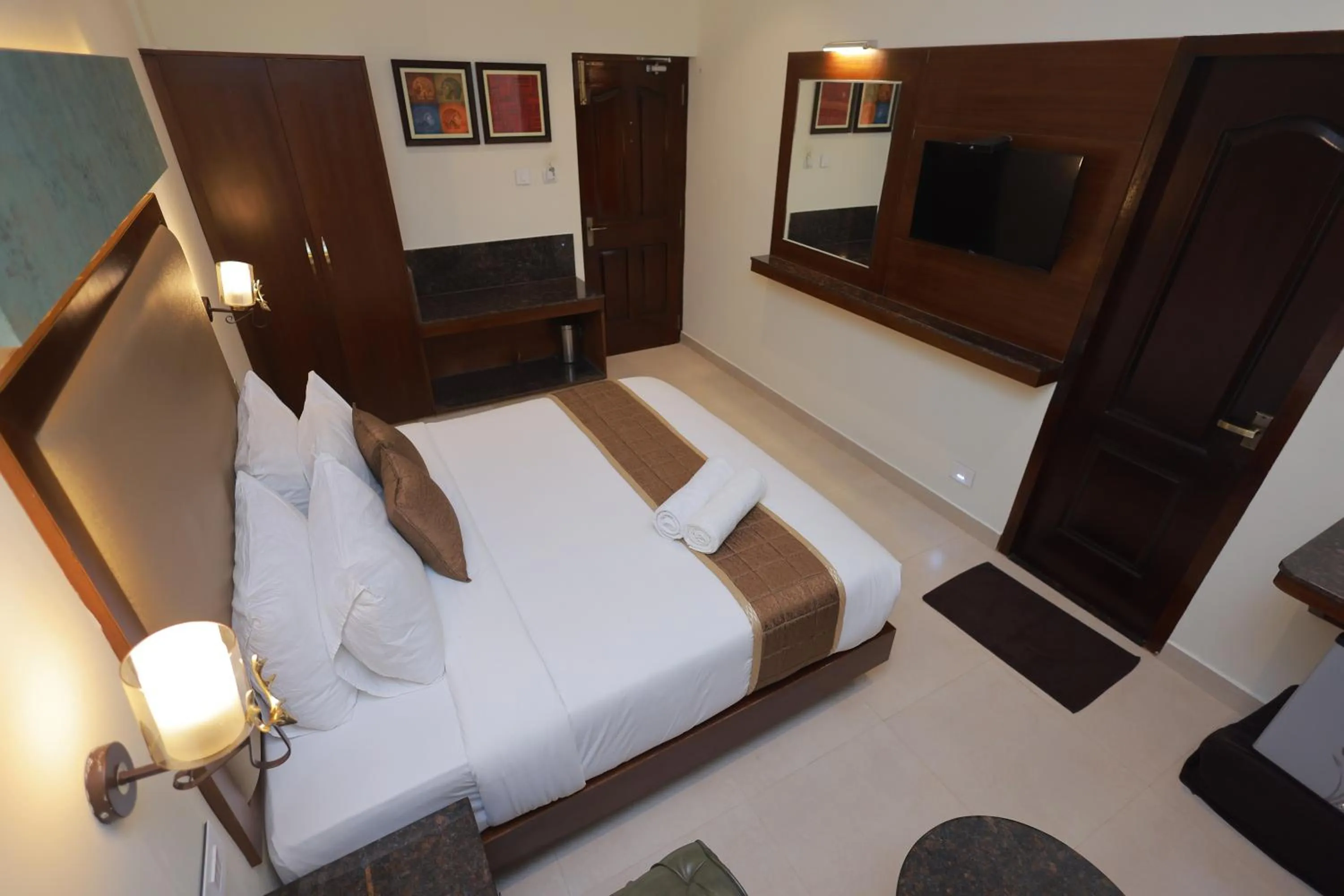 Bed in Hotel Comorin Grand