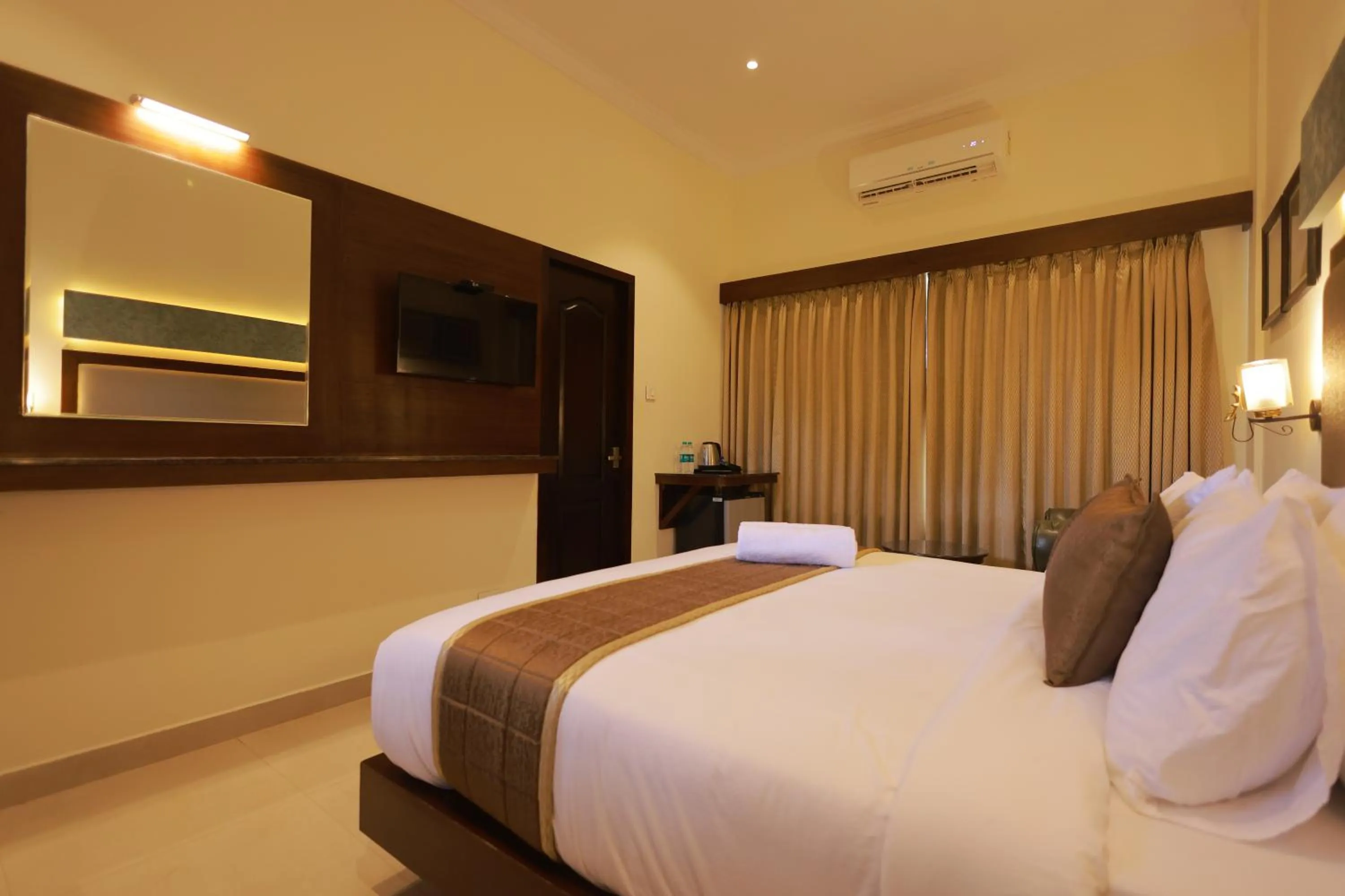 Bed in Hotel Comorin Grand