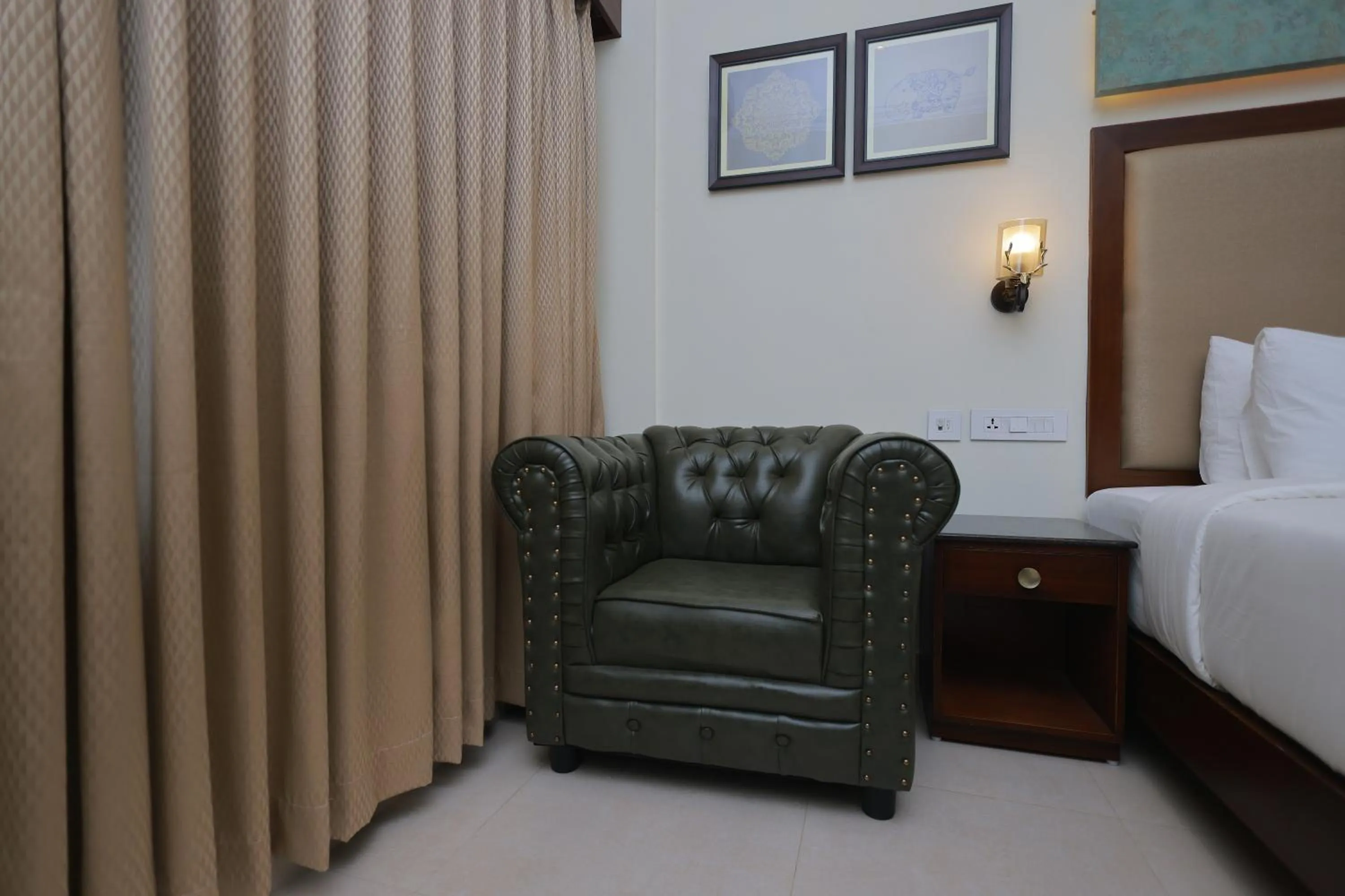 Seating area, Bed in Hotel Comorin Grand