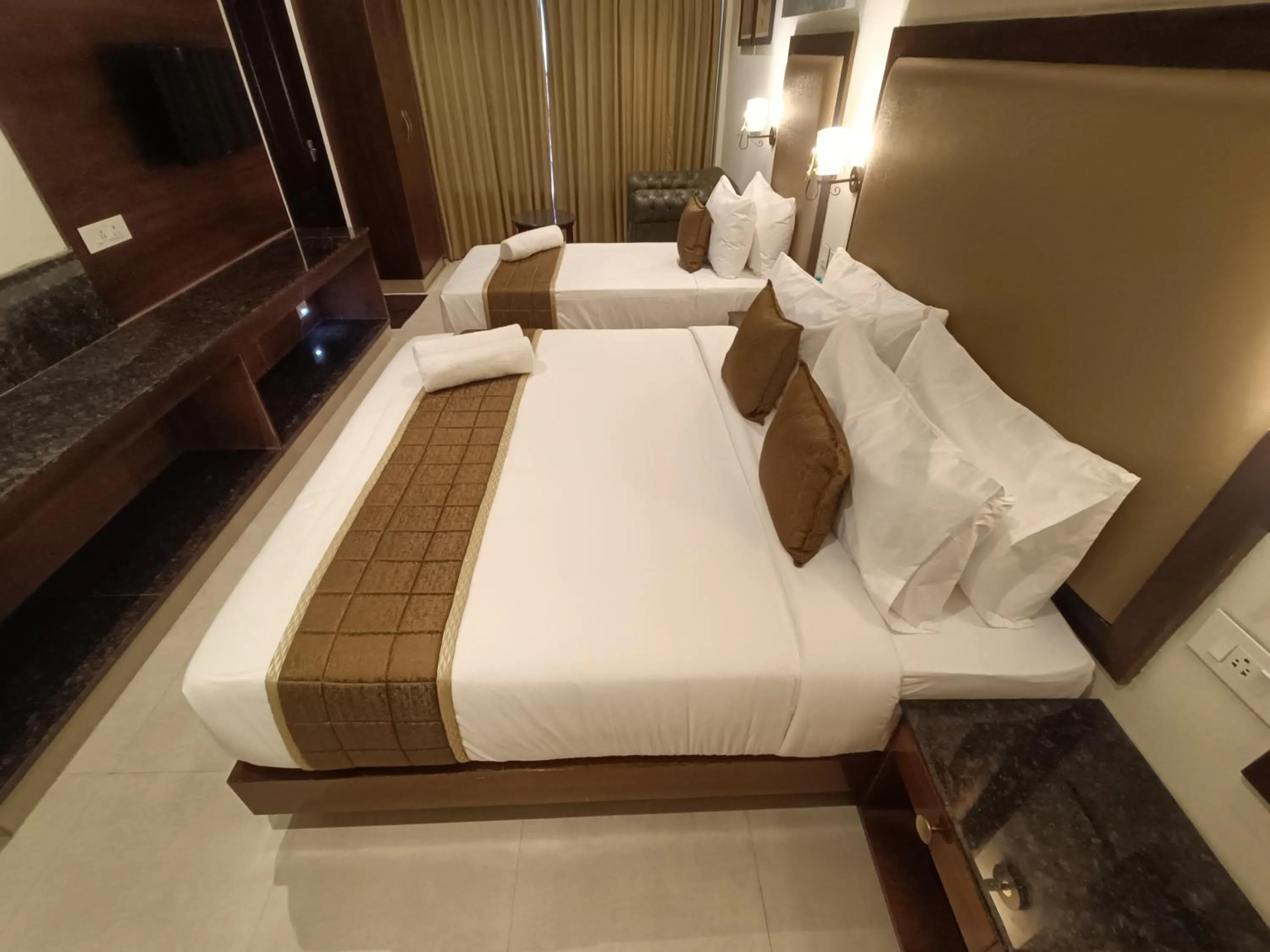 Bed in Hotel Comorin Grand
