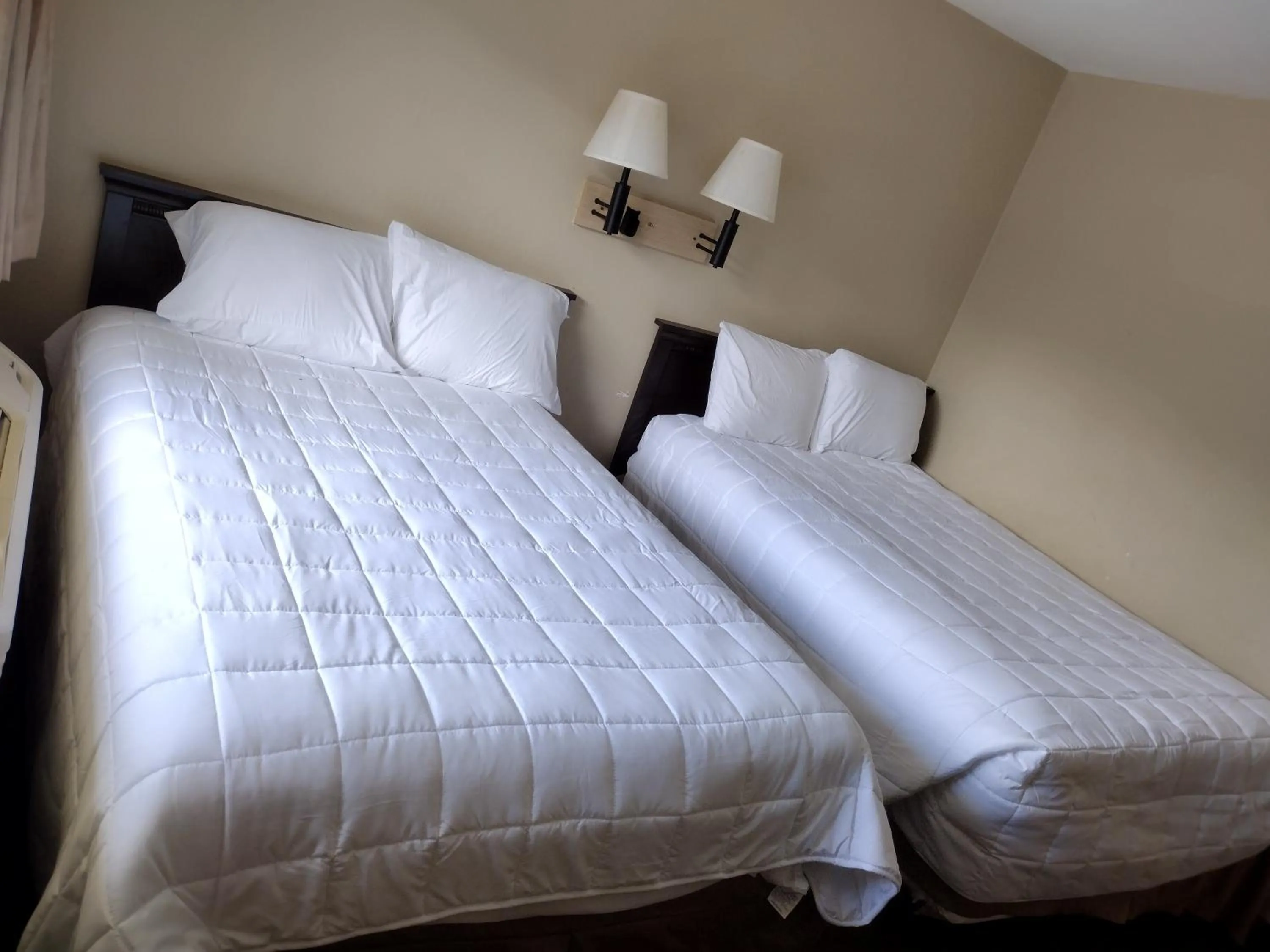 Bed in FairBridge Inn & Suites Richmond Hill