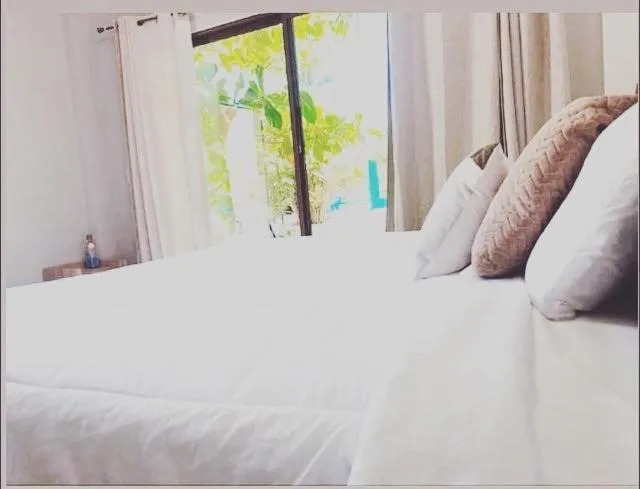 Bed in Sambo Mambo Beach Hotel