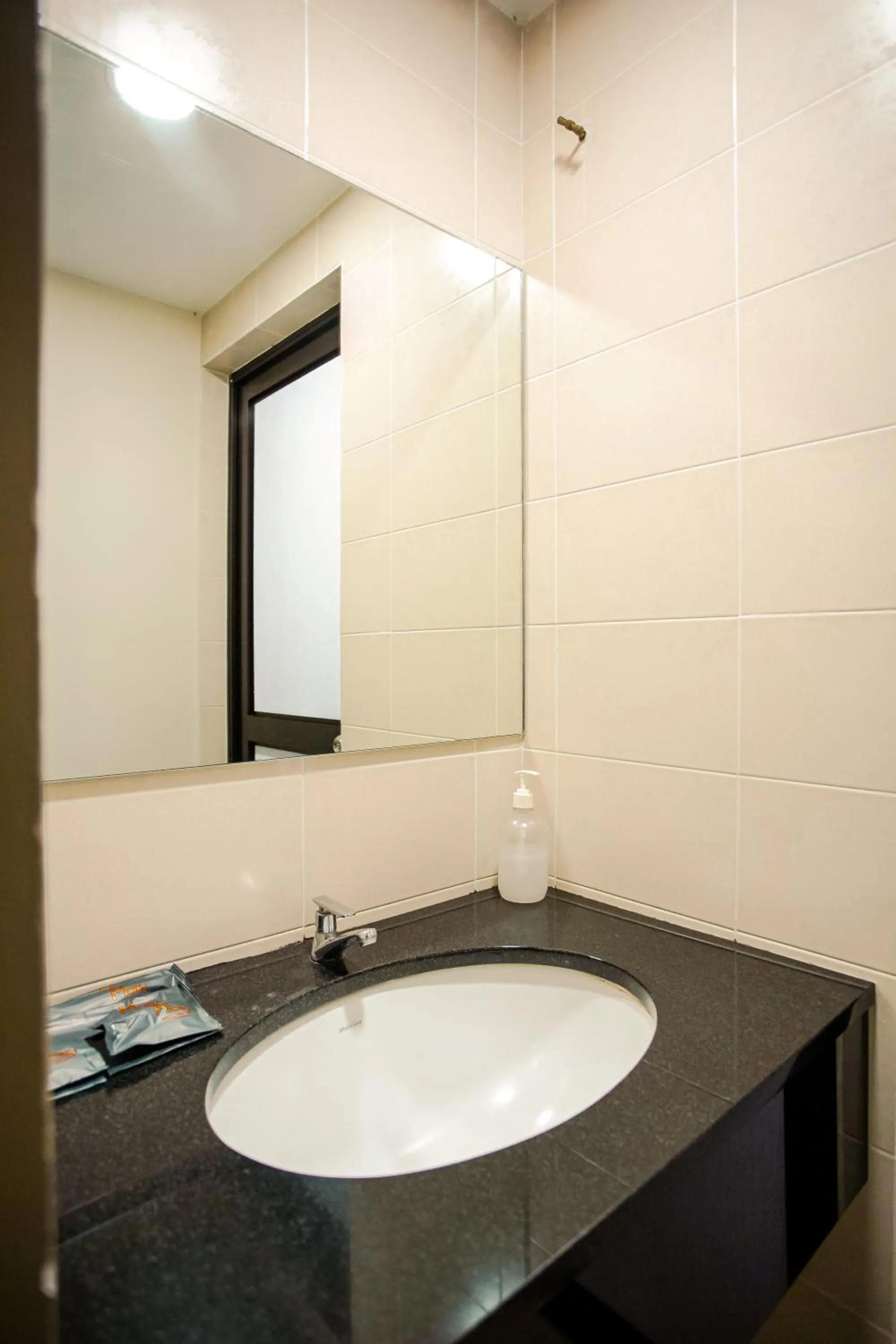 Bathroom in PP Hotel by Moxy