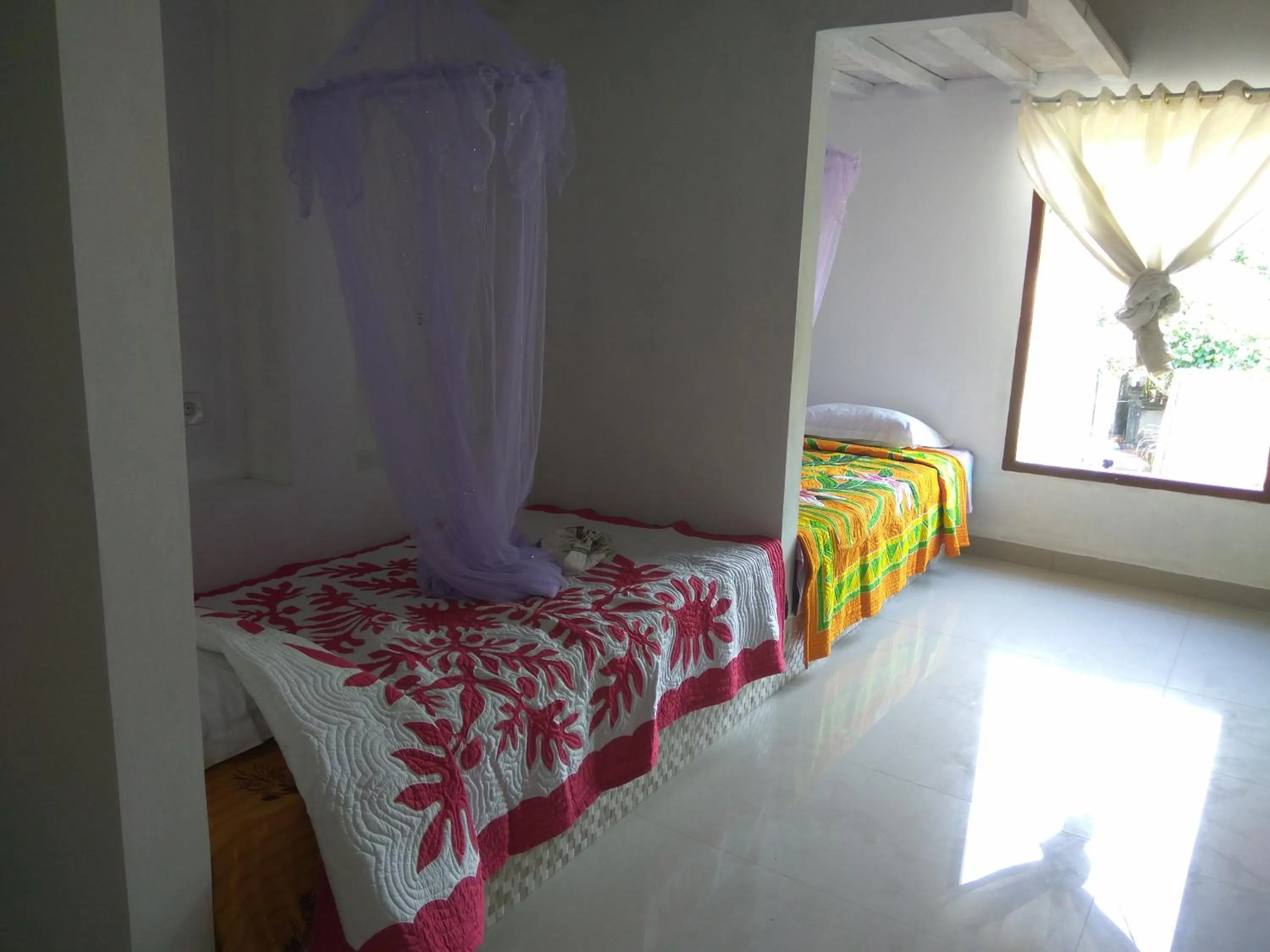 Bed in Bali Sari Homestay