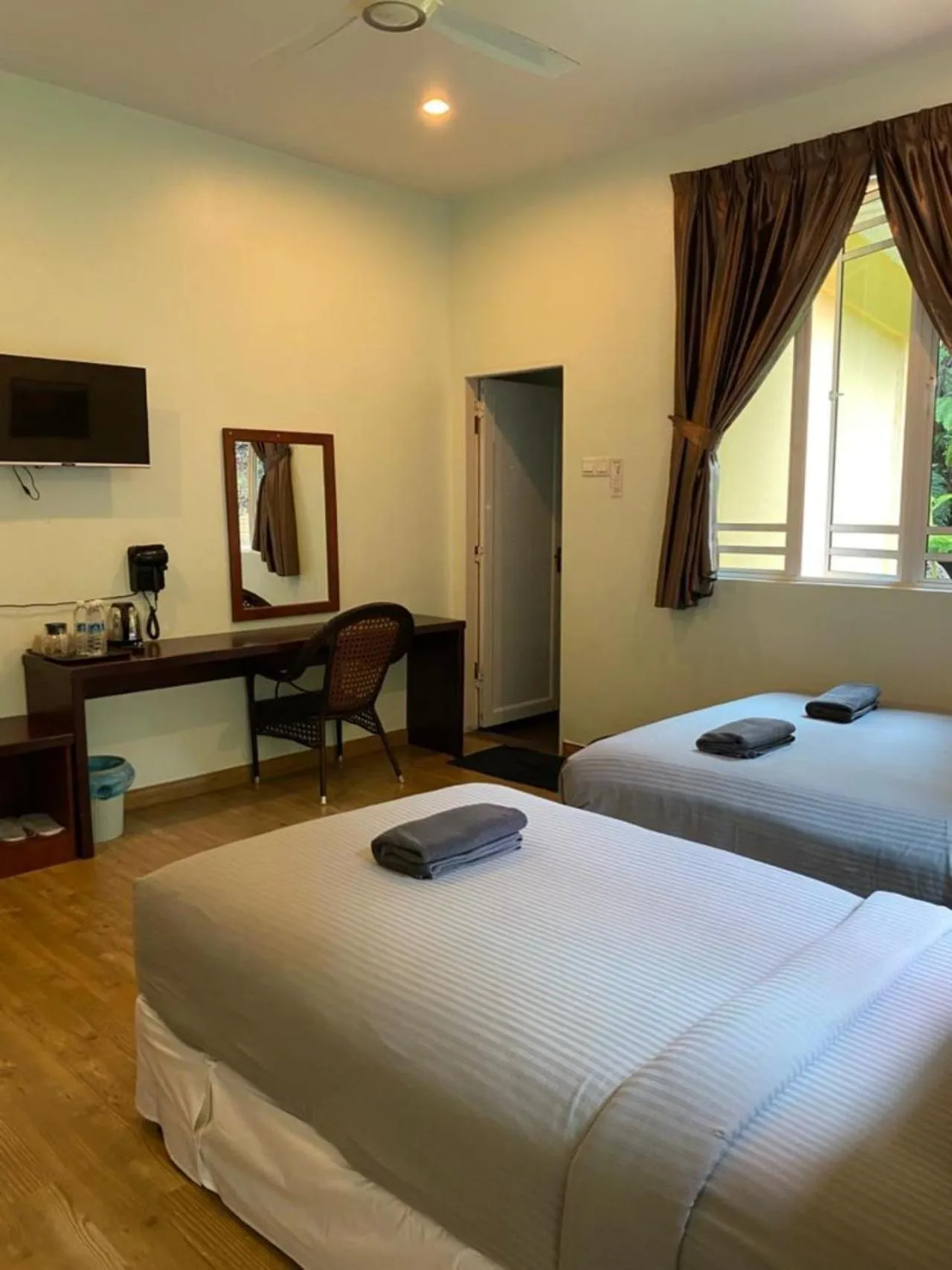 Bed in Highlanders Garden Guesthouse at Arundina Cameron Highlands