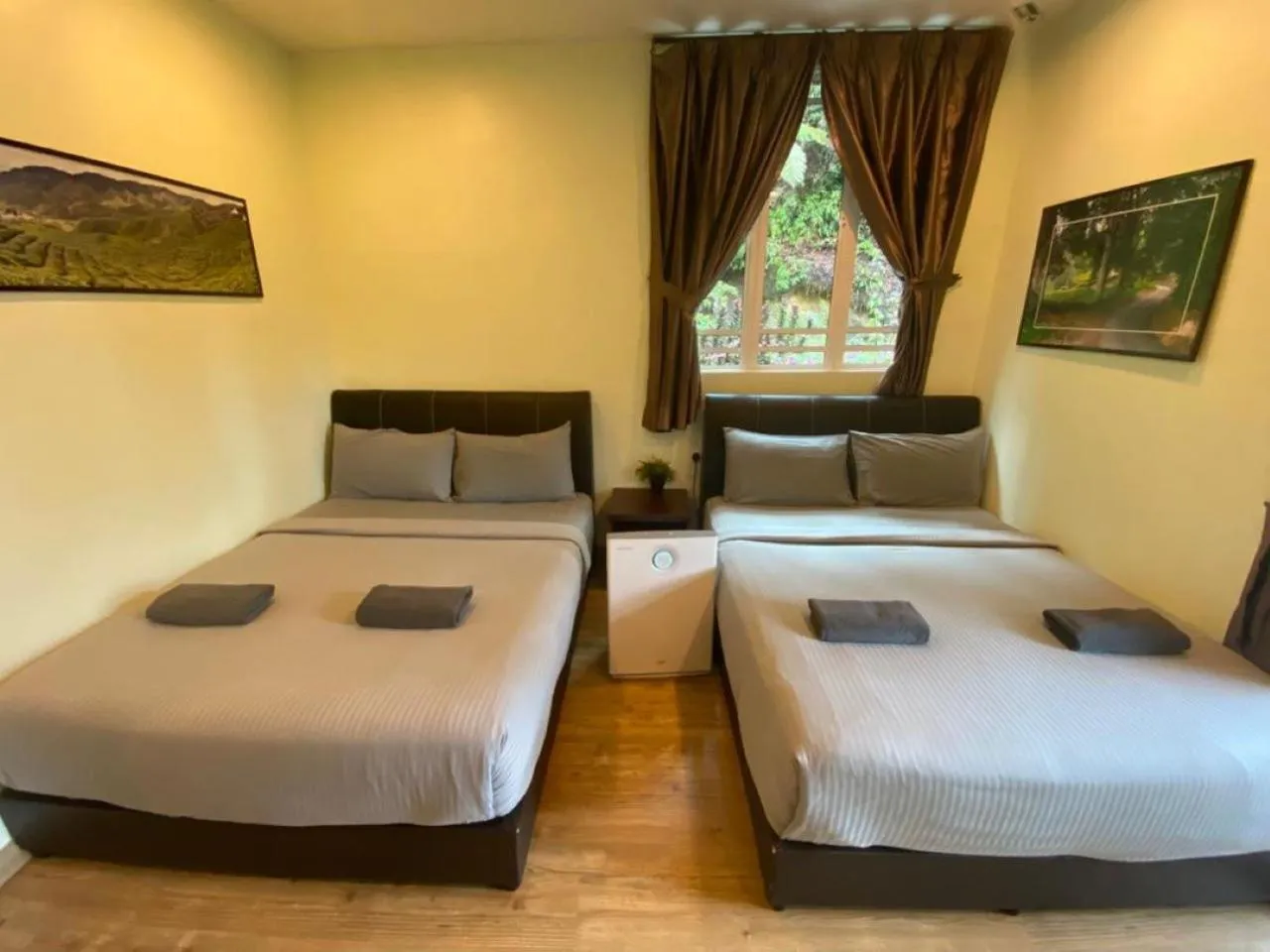 Bed in Highlanders Garden Guesthouse at Arundina Cameron Highlands