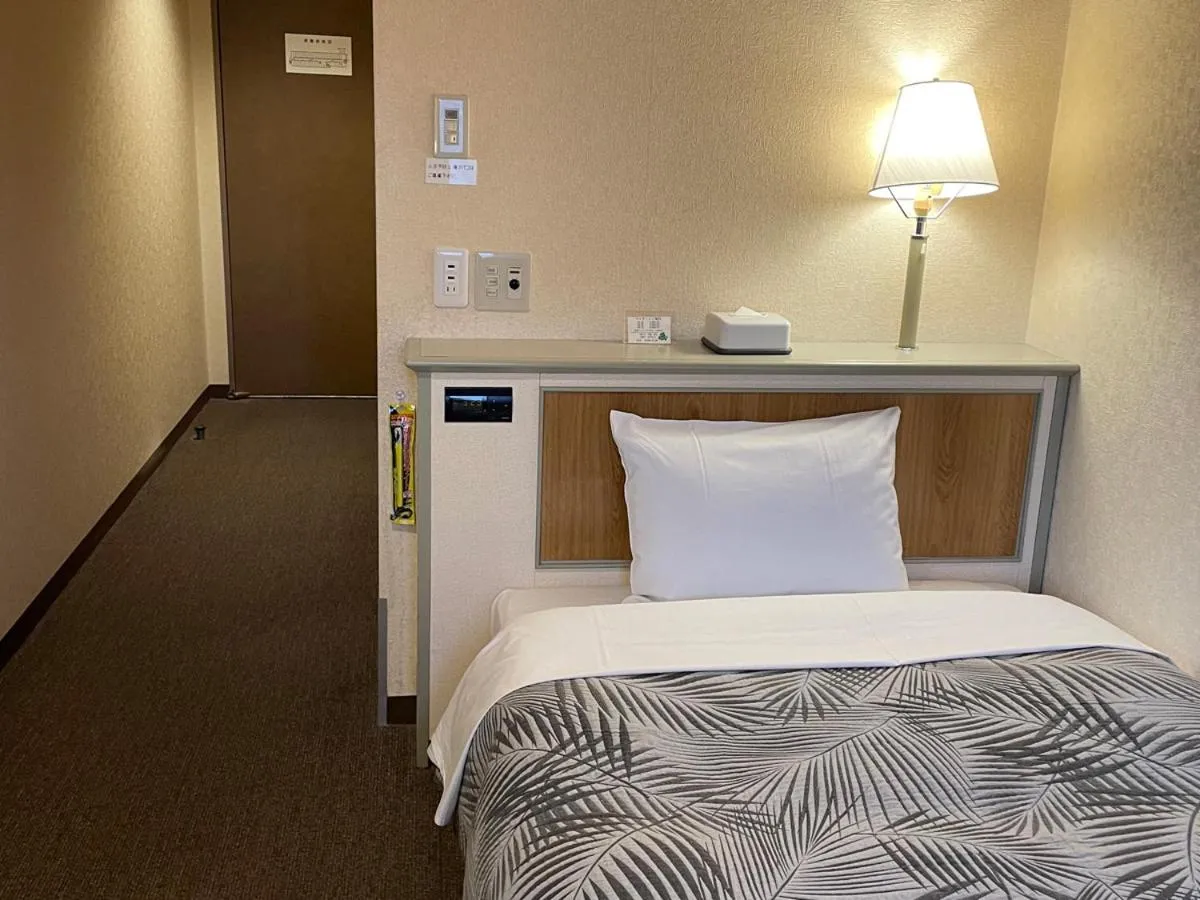 Bed in Hotel Machida Villa