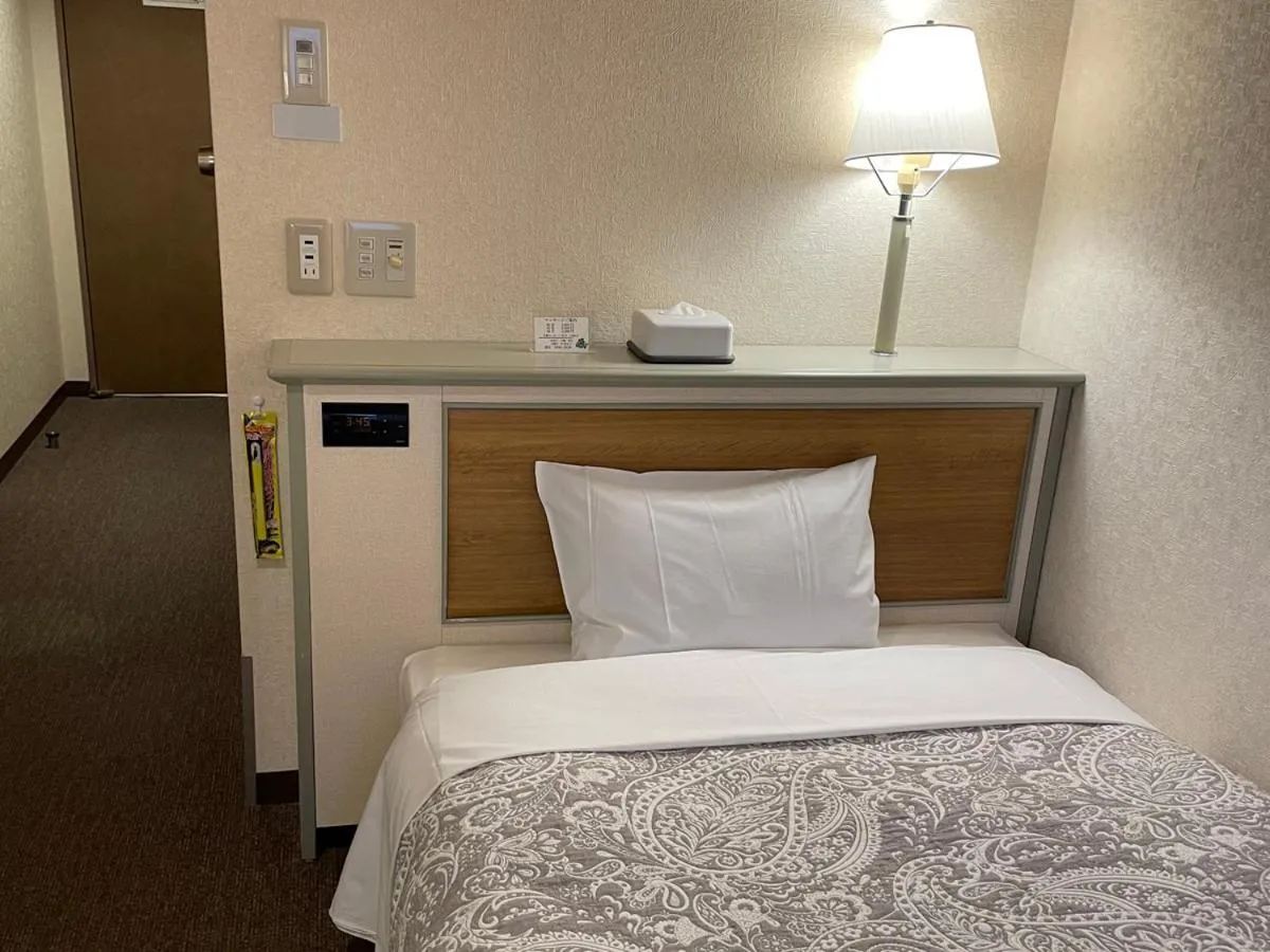Bed in Hotel Machida Villa