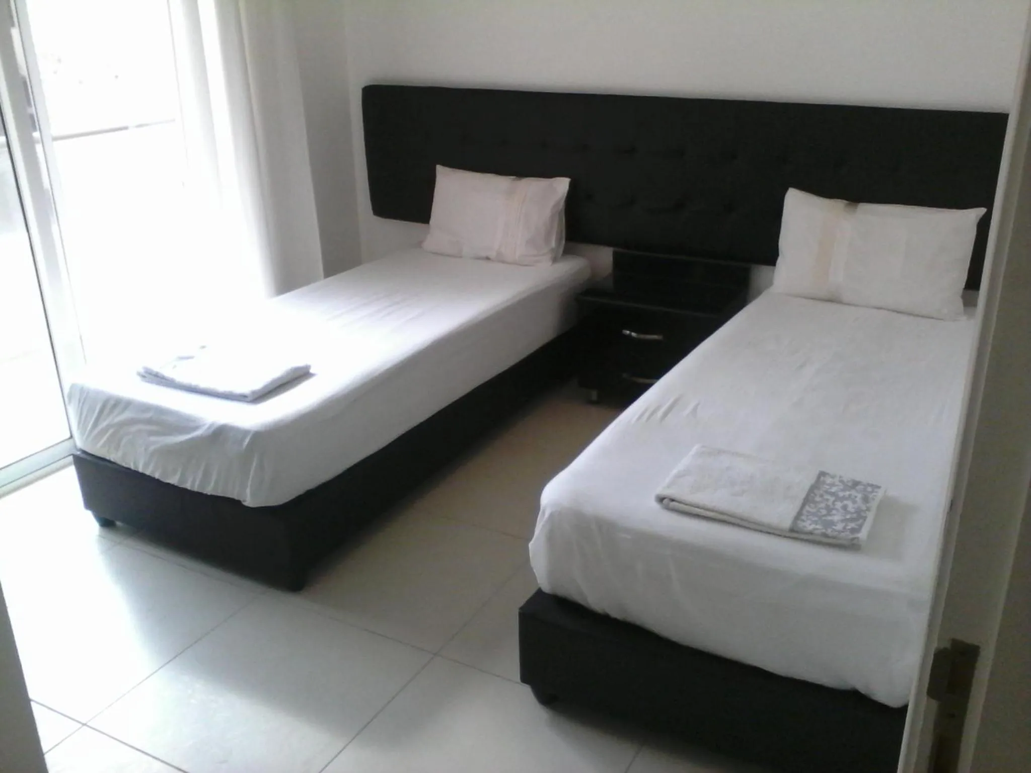Bed in The Place Apartments