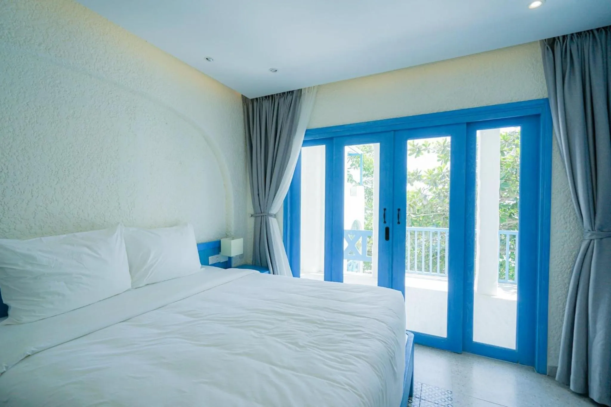 Bed in SUNTORINI BOUTIQUE HOTEL