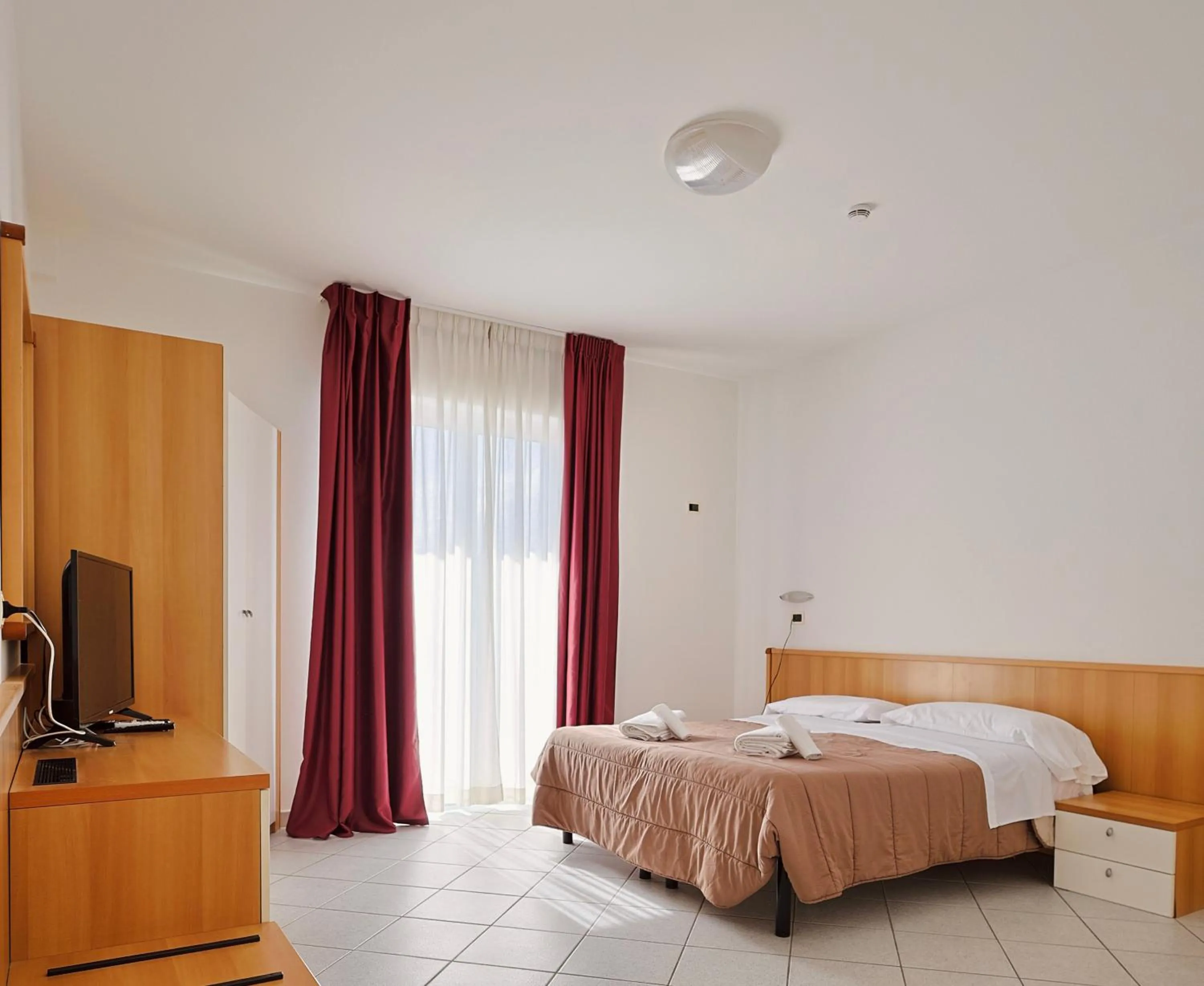 Bed in Hotel Felicioni