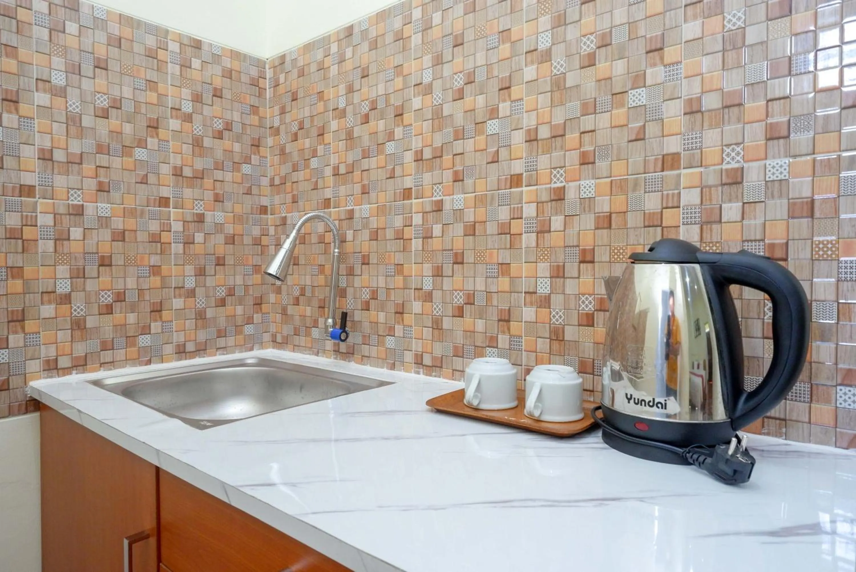 Kitchen or kitchenette in RedDoorz near Rita Supermall Purwokerto 2