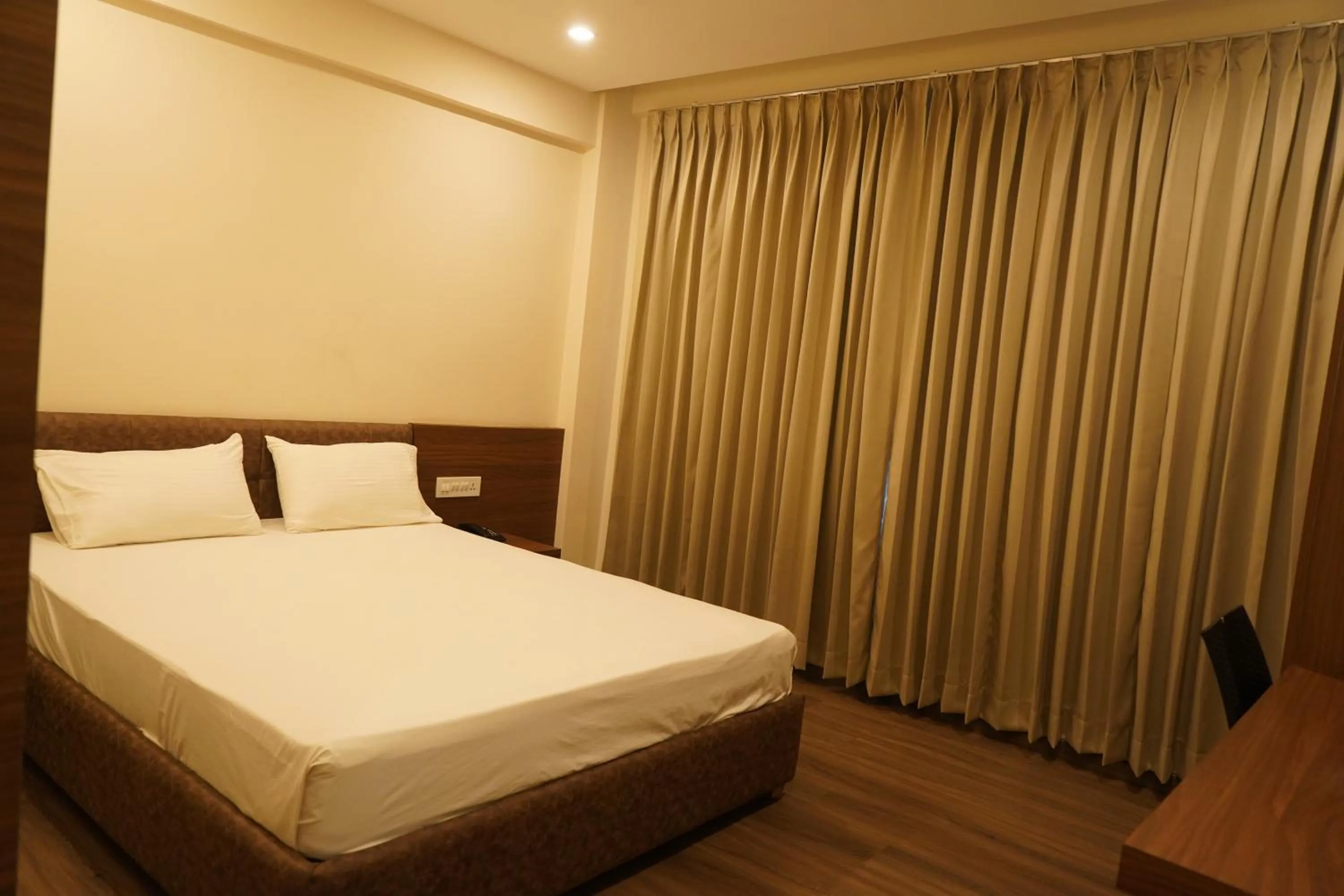 Bed in Hotel Bekal International