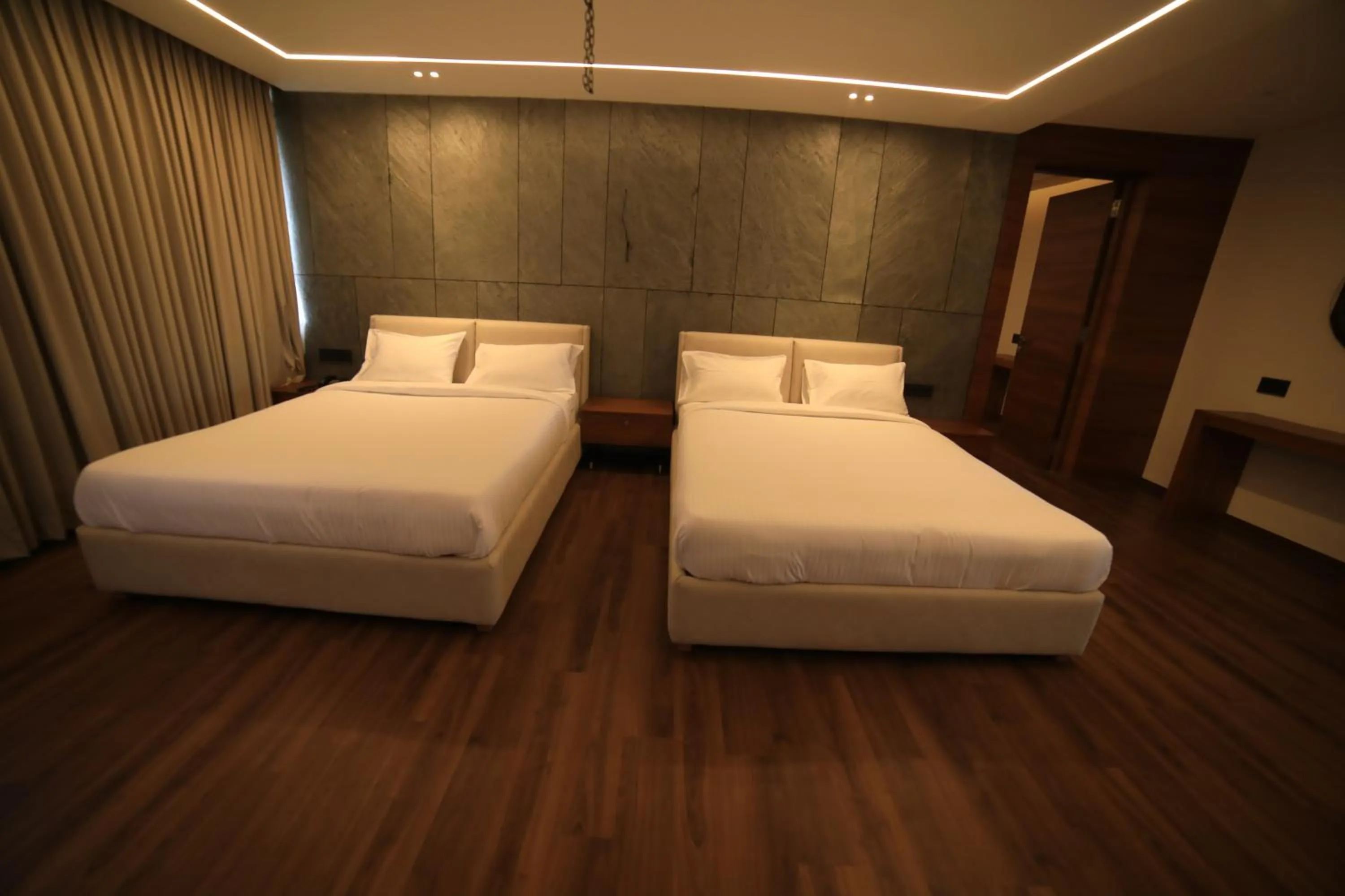 Bed in Hotel Bekal International