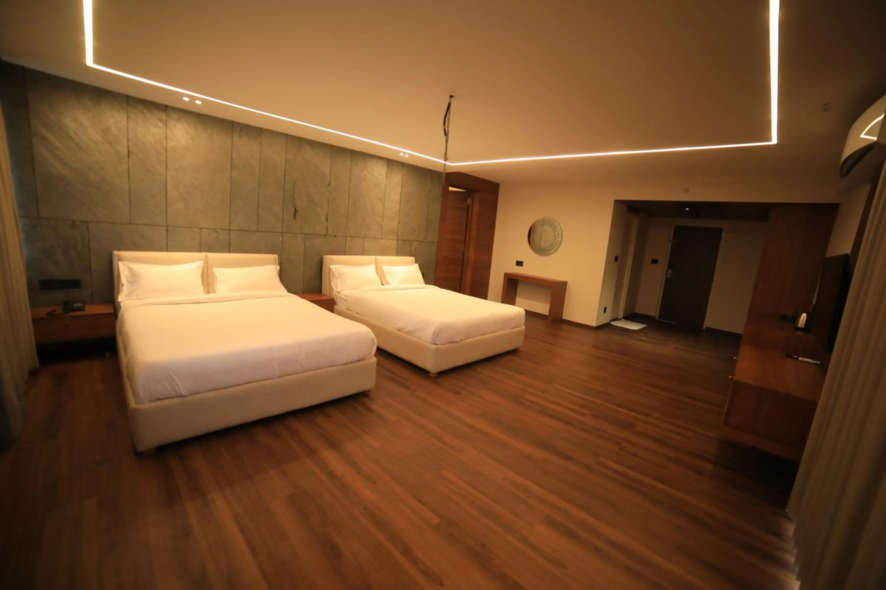 Bed in Hotel Bekal International