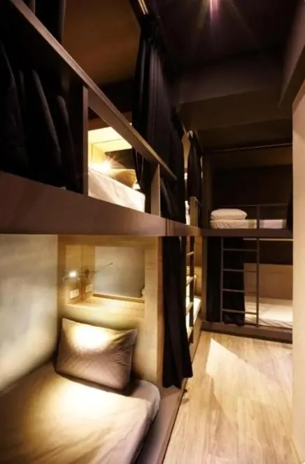 Bed in Main Inn Taipei