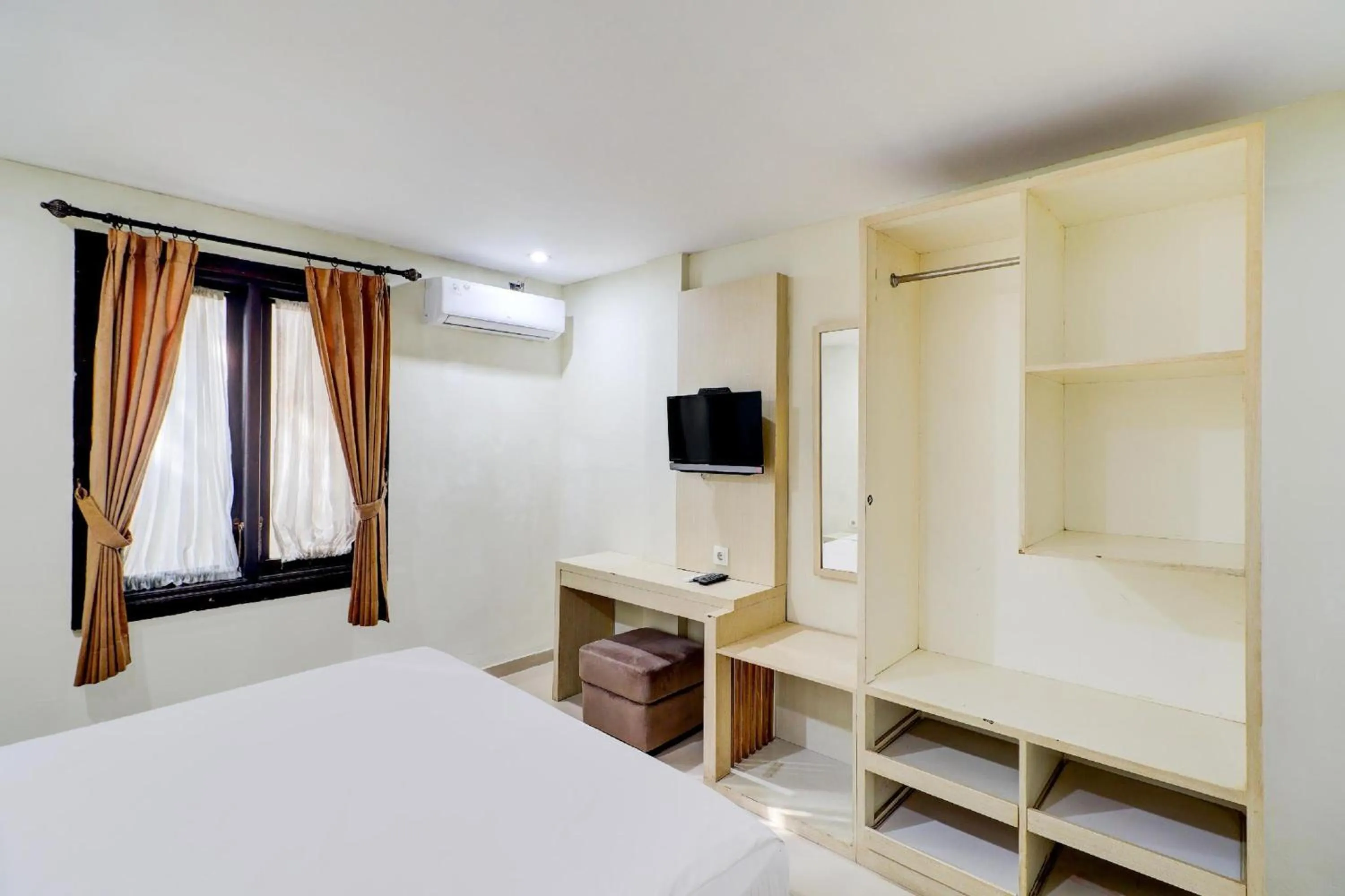 Photo of the whole room, Bed in Collection O Near Bajra Sandi Monumen Formerly Grand Pondok Puri Ayu