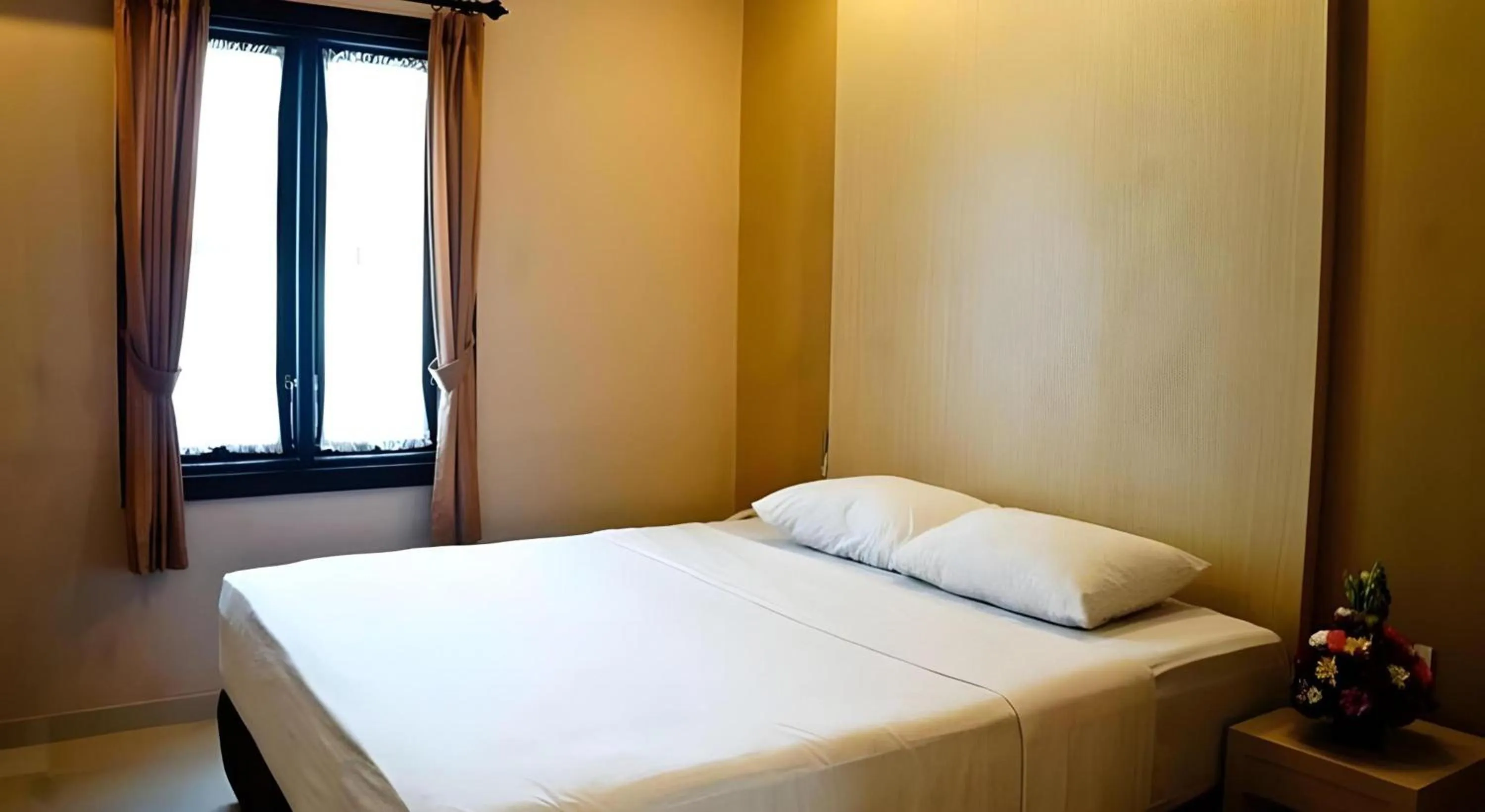 Photo of the whole room, Bed in Collection O Near Bajra Sandi Monumen Formerly Grand Pondok Puri Ayu