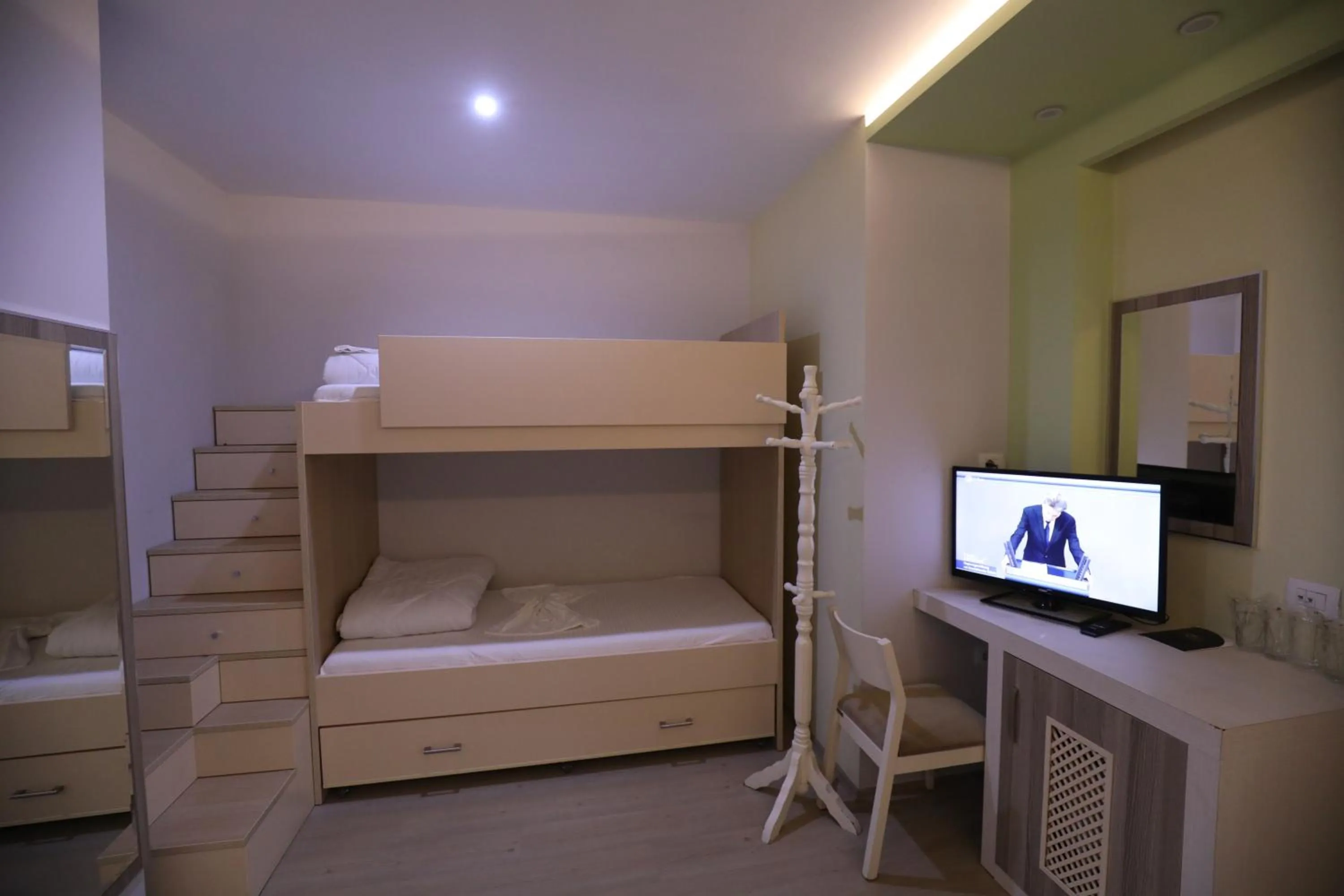 Communal lounge/ TV room, Bed in Hotel 1 Maji