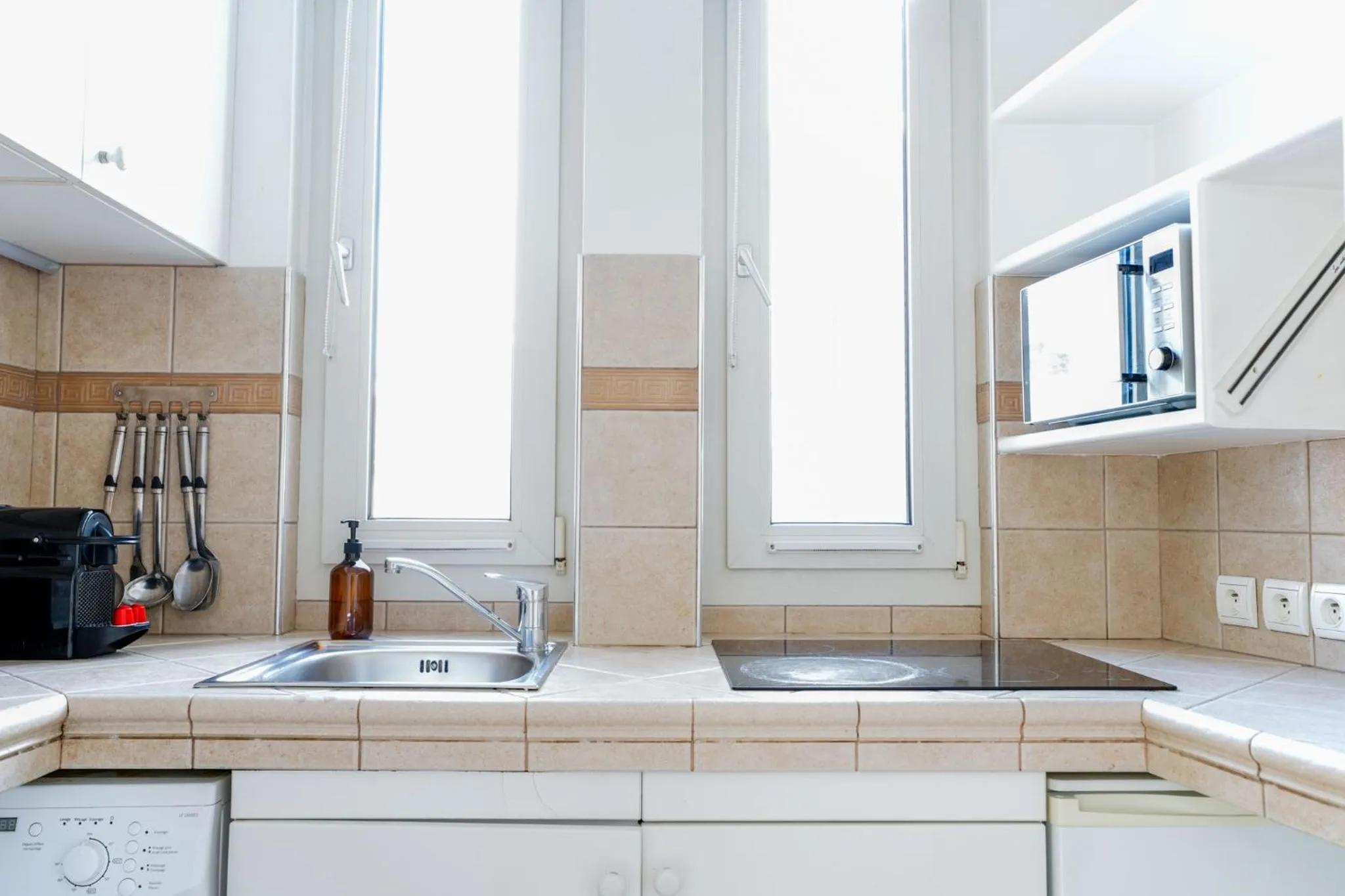 Kitchen or kitchenette in Appart Hôtel Résidence Courcelle