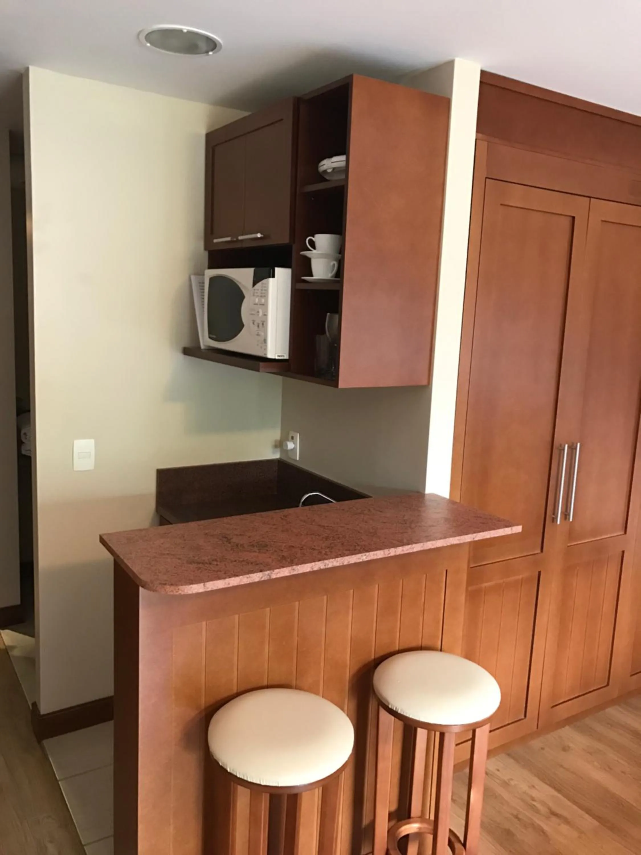 Kitchen or kitchenette in Flat em Gramado