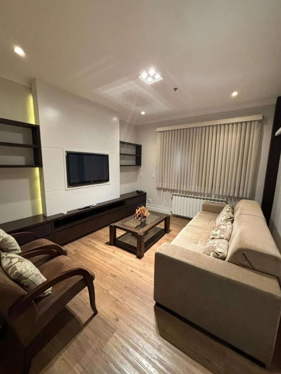 Communal lounge/ TV room in Flat em Gramado