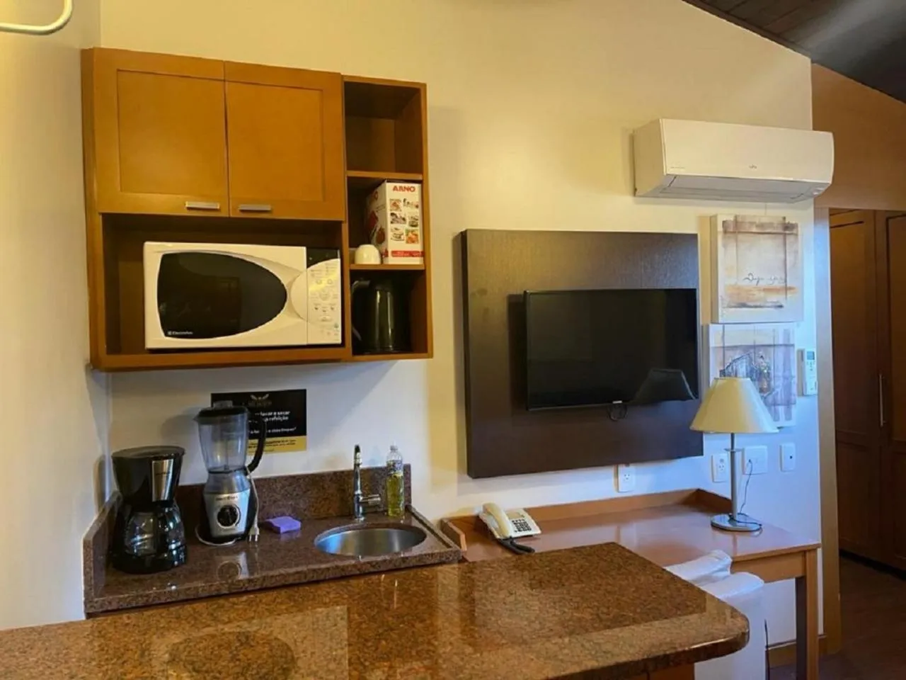 Communal lounge/ TV room in Flat em Gramado