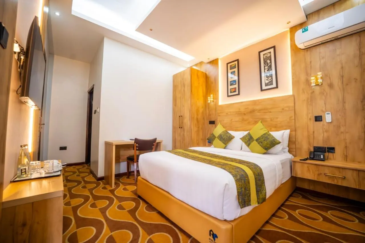 Bed in Afro Park Hotel