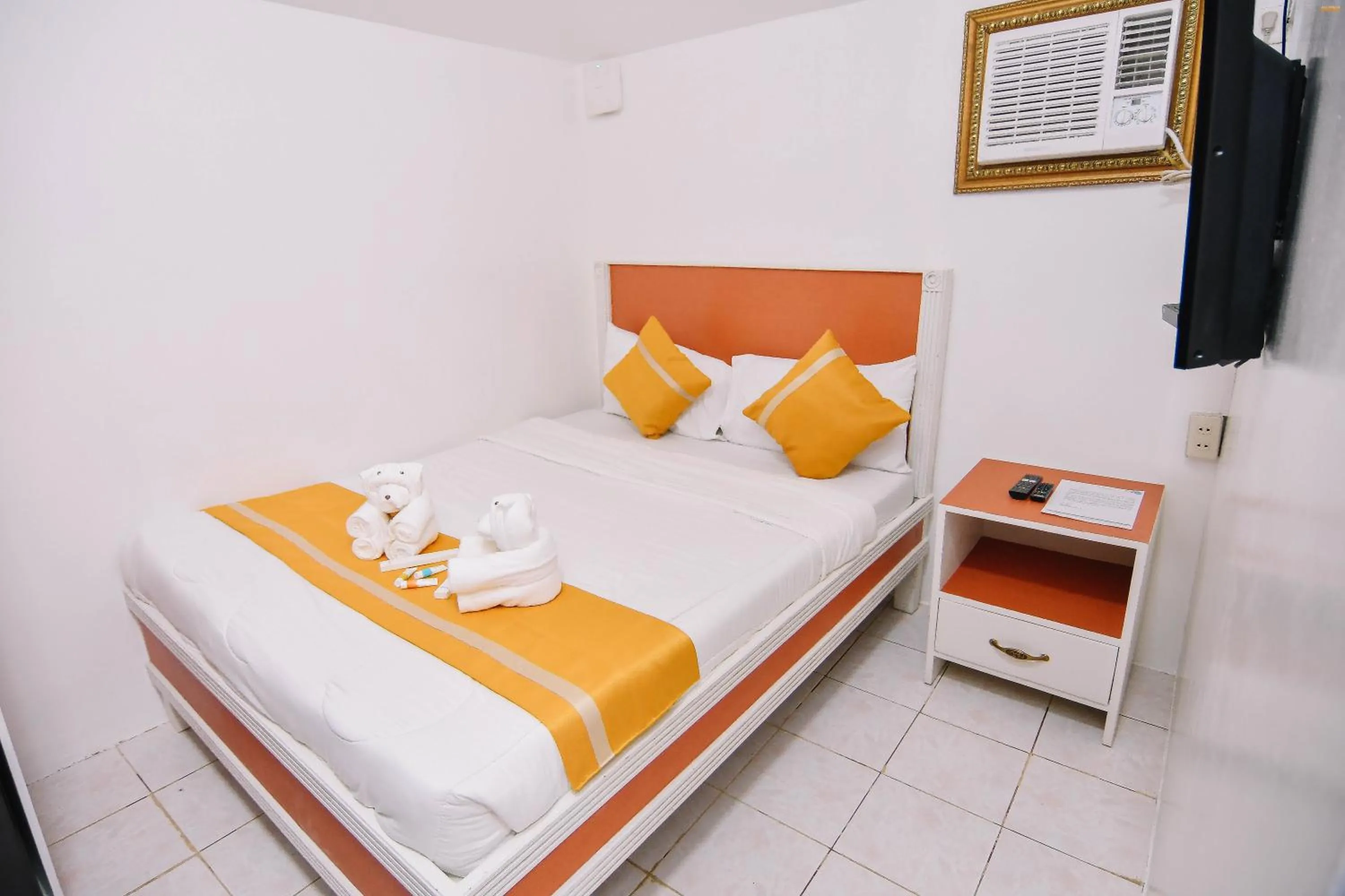 Bed in Villa Excellance Beach and Wave Pool Resort