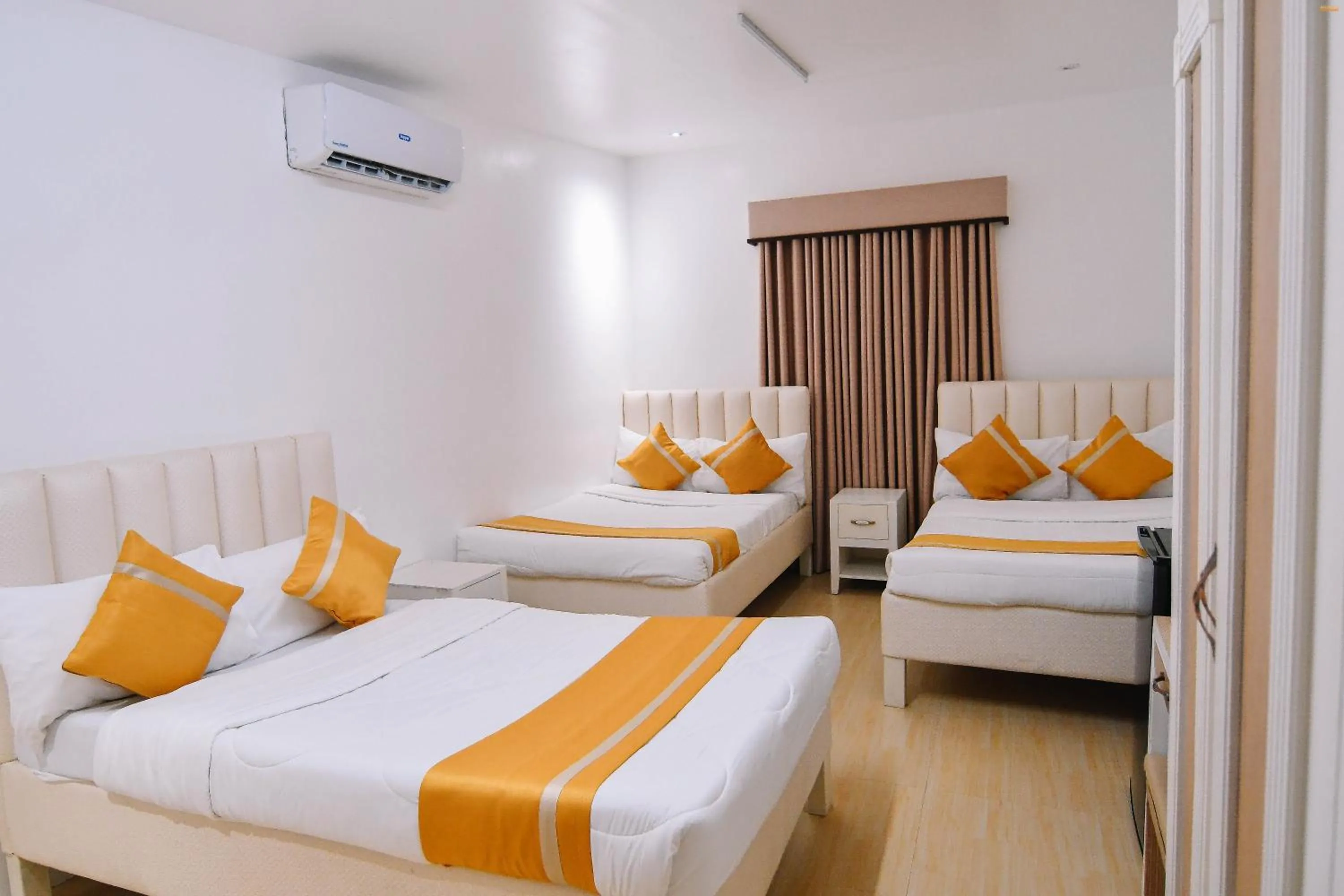 Bed in Villa Excellance Beach and Wave Pool Resort