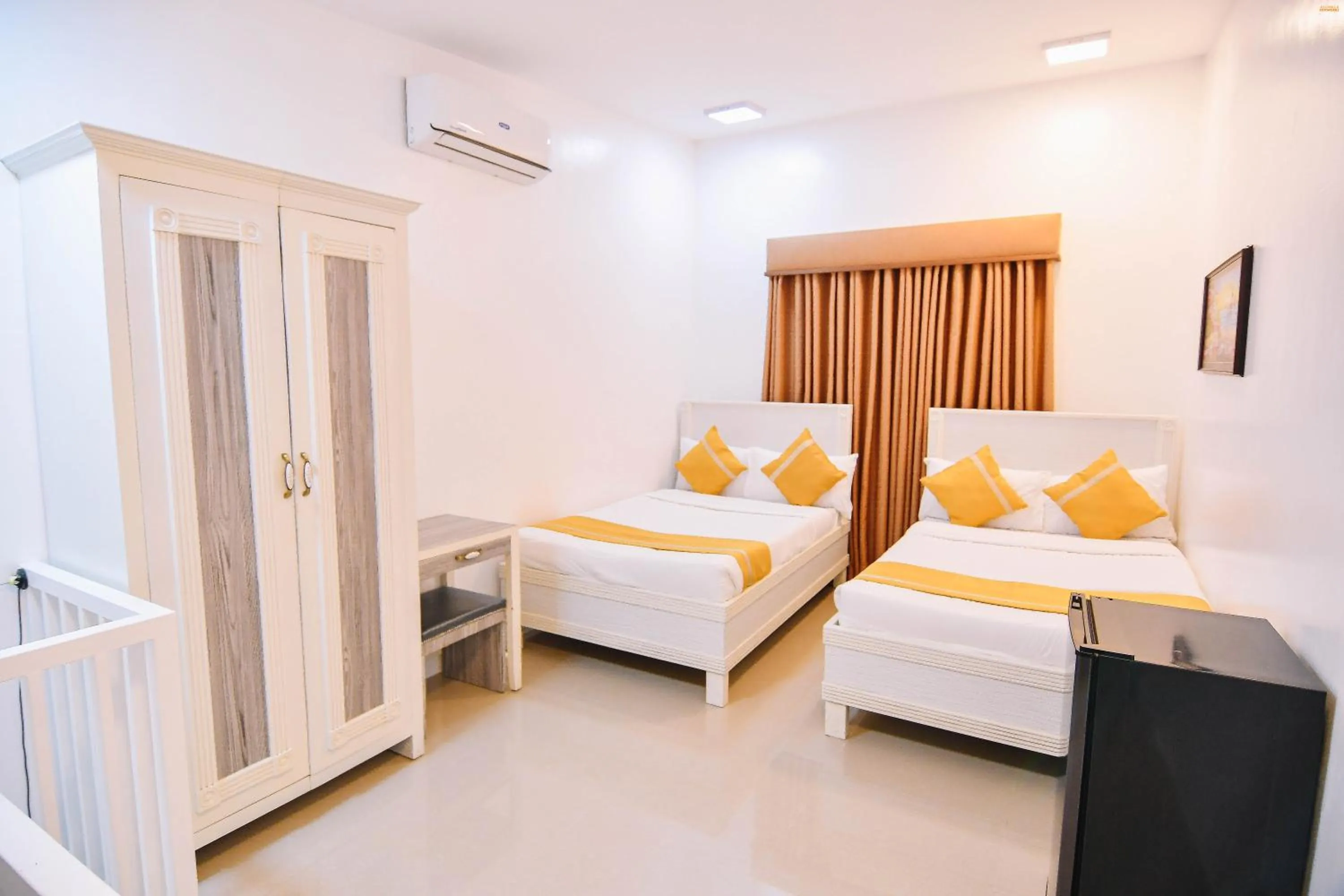 Bed in Villa Excellance Beach and Wave Pool Resort