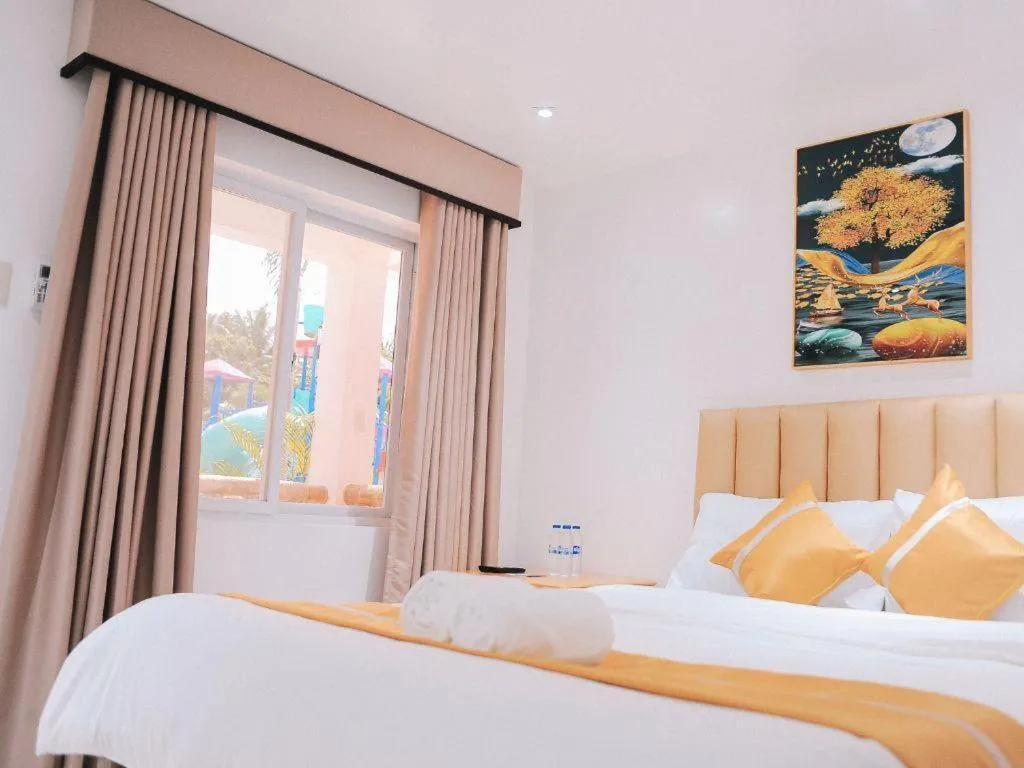 Bed in Villa Excellance Beach and Wave Pool Resort