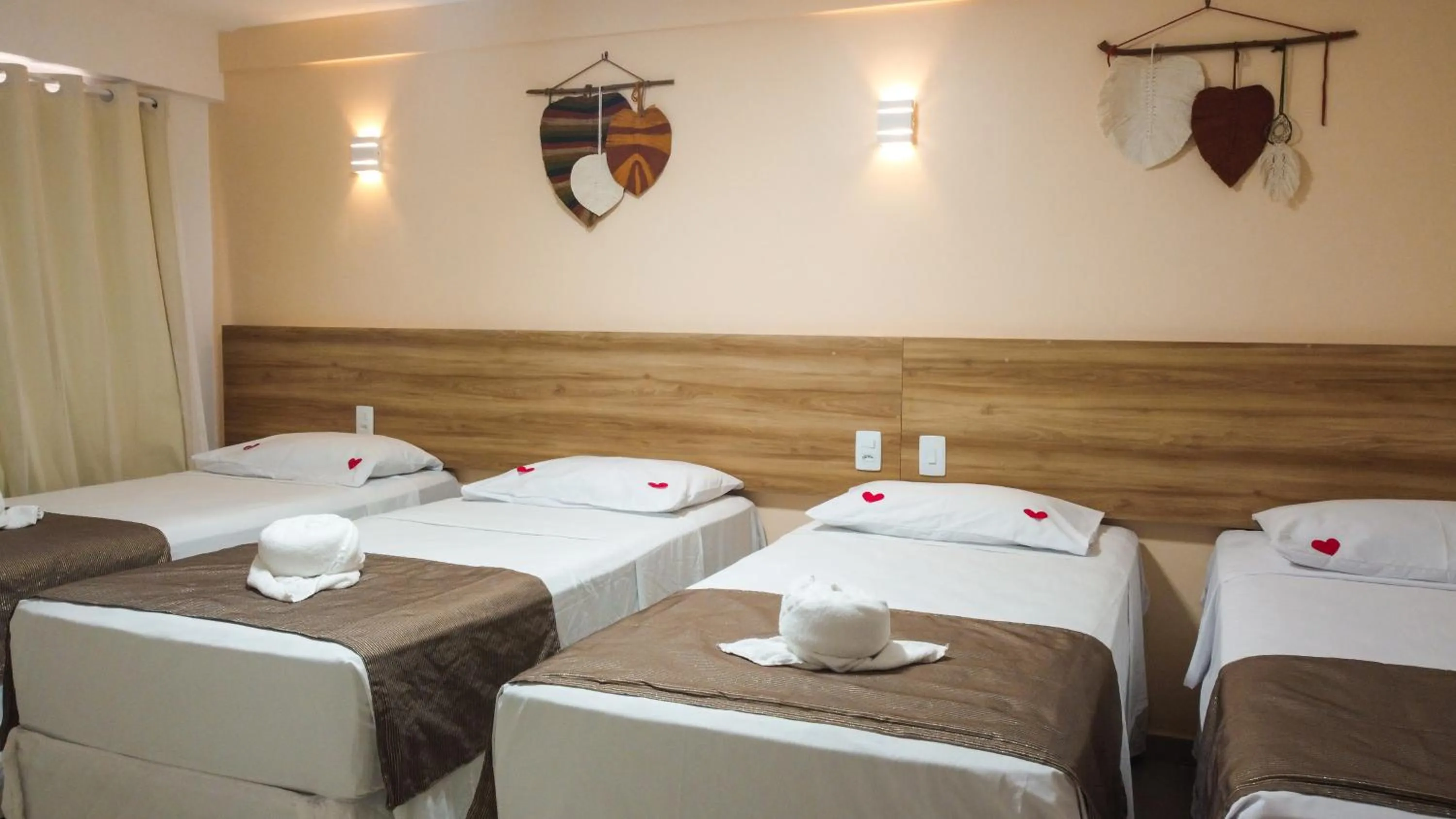 Bed in Pousada Jardins Tropical