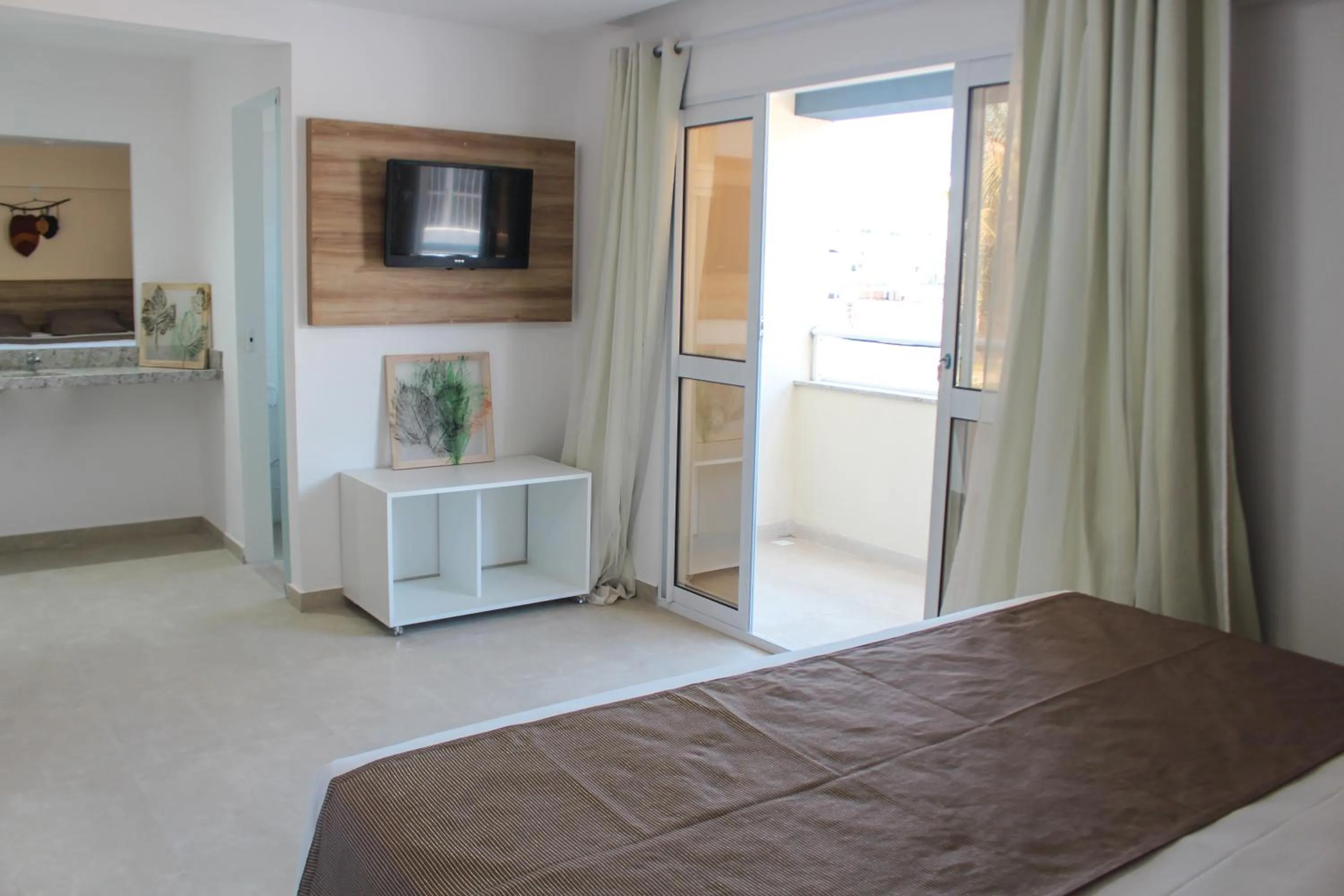 Bed in Pousada Jardins Tropical