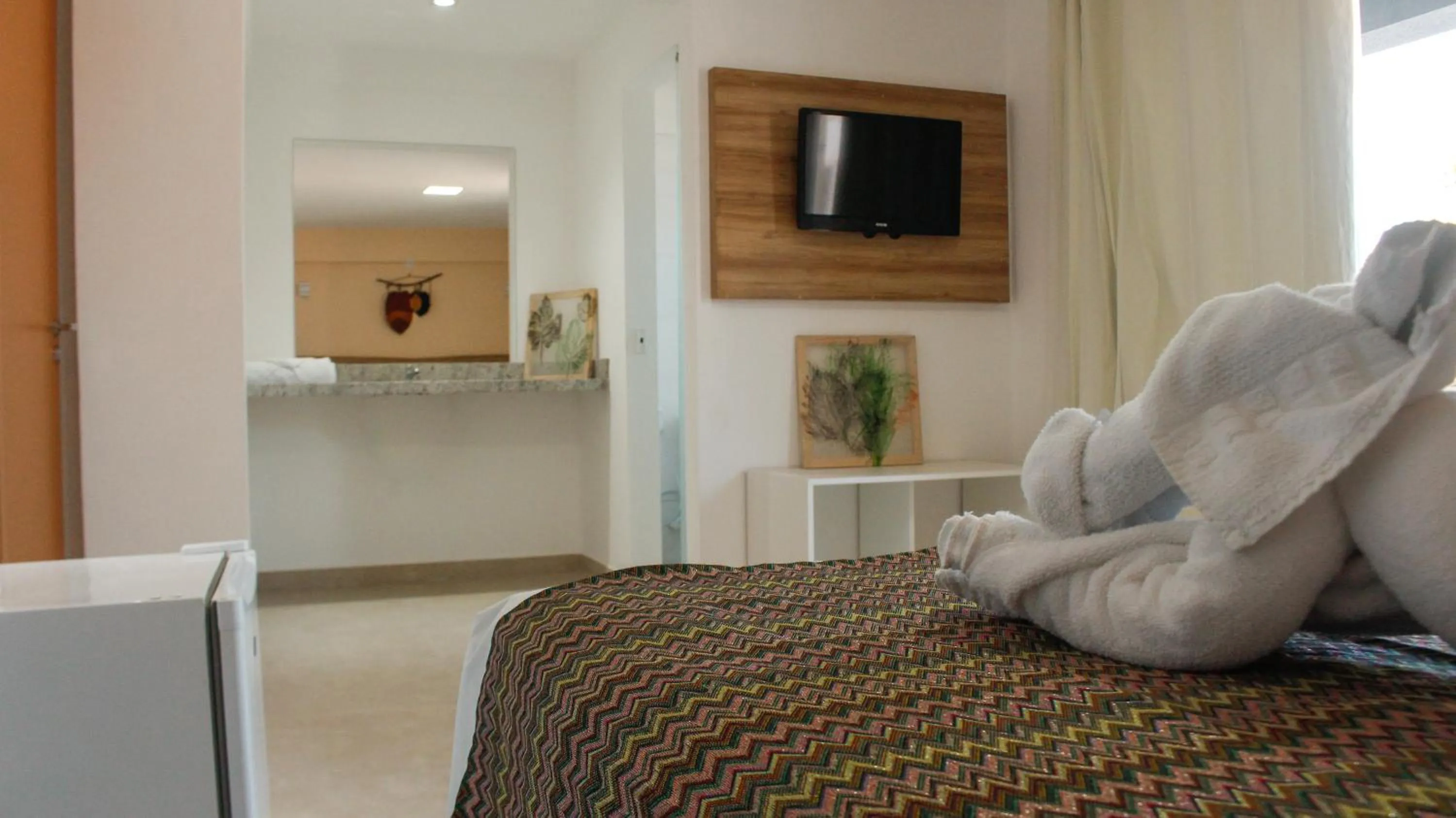 Bed in Pousada Jardins Tropical