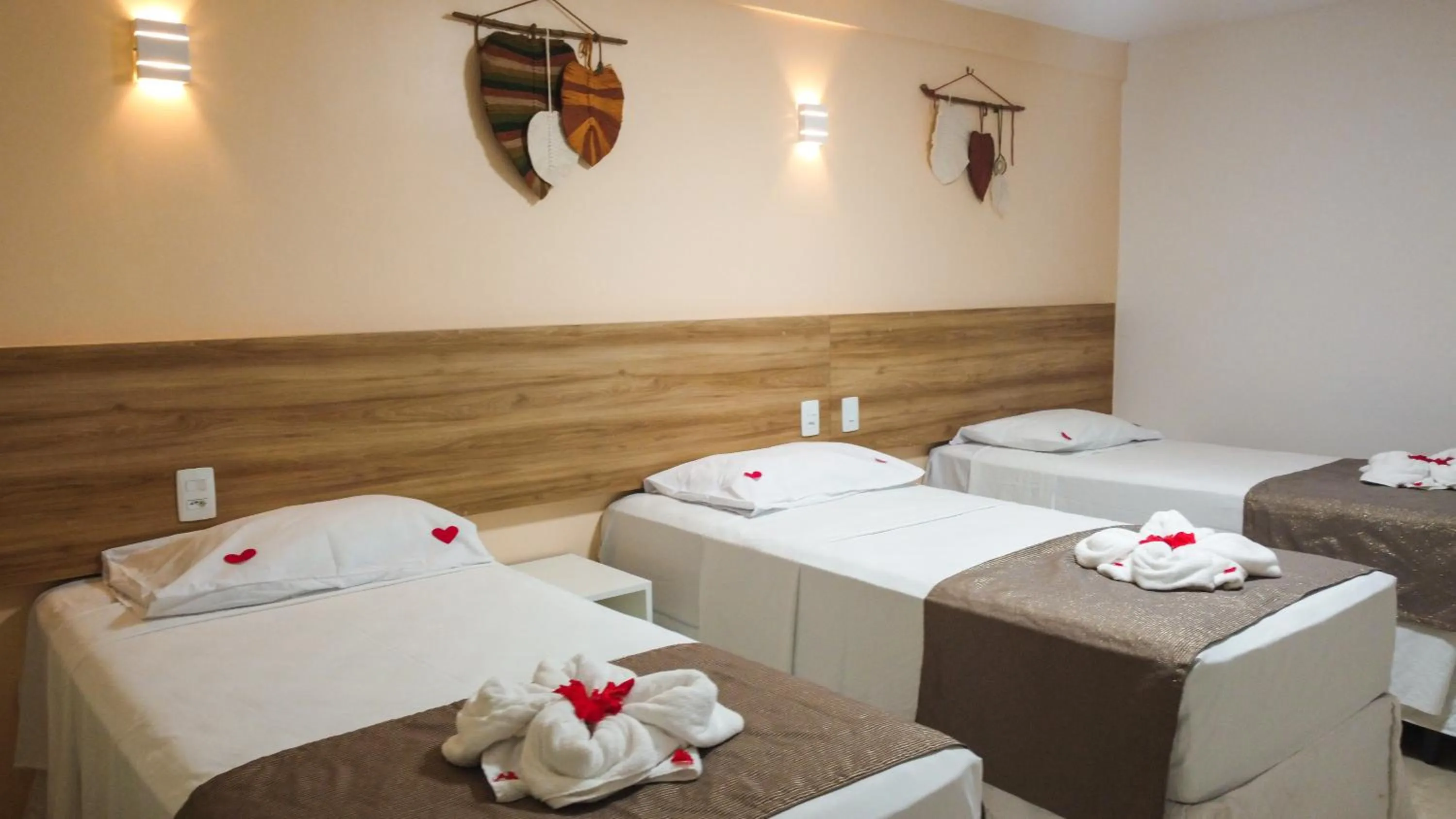 Bed in Pousada Jardins Tropical