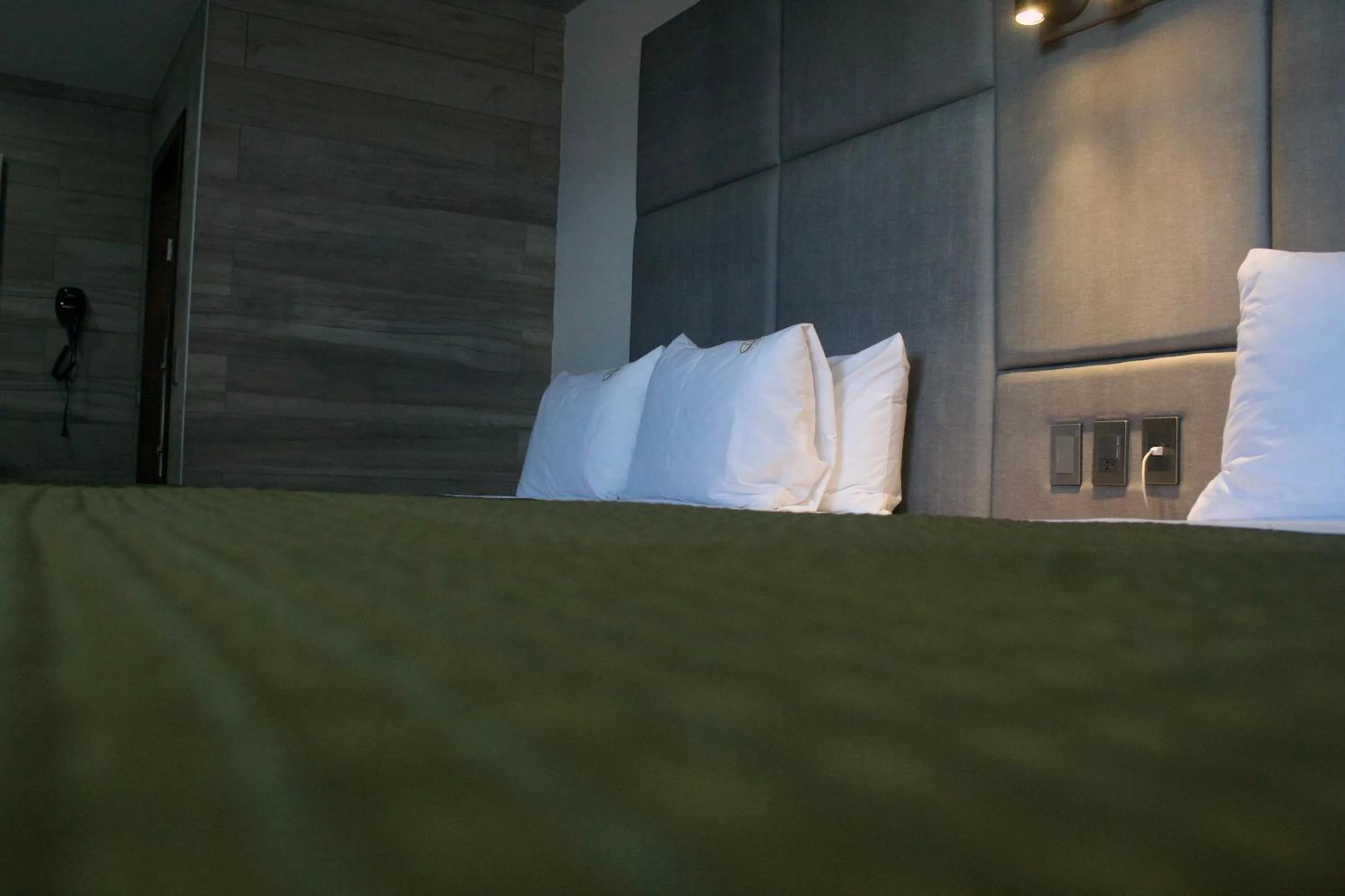 Bed in Hotel Grand One Plaza